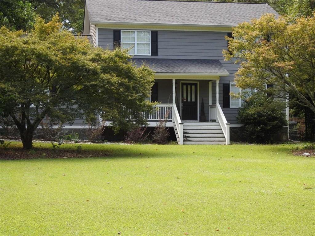 This home is on a Huge older Gwinnett county lot in sought after North Gwinnett Estates, over 1.5 acre level lot. No HOA just for grounds upkeep. This large home has 5 rooms on the main floor which one includes a sliding barn door and 4 on the second floor with an additional large building in the back yard with another 1-2 rooms and a single garage in additon to the 2 car garage attached to the house for a total of 10 rooms and 3 garages. Large level rear yard is separated into 3 different areas by large established trees (able to support 3 events at one time), landscape and flowers creating private areas. Inground heated Pebbletech Pool, works and is currently running just needs cleaning, waterfall into the pool needs a part and it will work. Double wrought iron gate for easy vehicle, boat even RV access to the rear yard. Minor cosmetics repair, owner is unable to at this time due to health. Home has solar panels on the back of the house, sun room/large dining area, exterior stone walkways, pebble granite saltwater pool, walking paths through the landscaped flower gardens, This home is close to shopping, malls, Lake Lanier, several parks, golf courses, airport and I-85, 30 min NE of Atlanta. Seller is selling due to a reduced income and health concerns. Swingset and side deck that is not covered is not safe, please use caution. This side deck area used to support a hot tub that was removed by the prior owner and not covered well, only a temporary fix. A hot tub could go back in this area. Altough price is pretty firm let's talk..