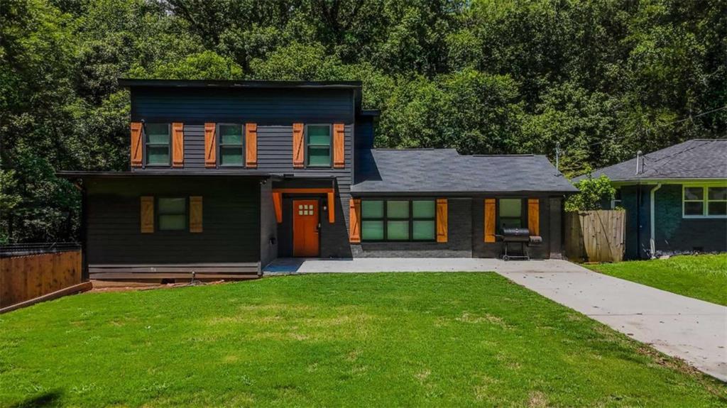 Discover this modern 4-bedroom, 3-bathroom home located in the Historic Lakewood Subdivision. Designed with comfort and convenience in mind, this property is ideal for both long-term living and short-term stays. Step into a stylish kitchen featuring stainless steel appliances-range, dishwasher, over-the-stove microwave, and refrigerator-paired with timeless shaker-style cabinetry. The home is equipped with a full alarm system, integrated smoke alarms, and secure electronic keypad locks for peace of mind. Enjoy unbeatable location benefits: just minutes from shopping, grocery stores, and a wide variety of restaurants. The property is less than one mile from a golf course and only 10 minutes from both Downtown and Midtown Atlanta, offering quick access to work, hospitals, and entertainment. This home is available furnished or unfurnished, making it a flexible option to suit your lifestyle needs.