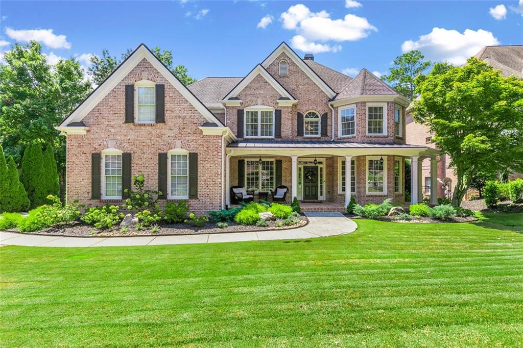 In the Glenaire section of Hamilton Mill, community is everything. Neighbors know each other by name. Tennis and pickleball matches turn into social events. Holidays spill out onto the sidewalks. Golfers hang out at the clubhouse after a day on the golf course, and walkers and runners fill the trails at Little Mulberry Park. So many choose this corner of North Gwinnett not just for the top-rated Mill Creek schools but for the sense of belonging that’s so hard to find. This home has been part of that story. Its heart is the kitchen, redesigned from the studs up to create a space that feels as practical as it does beautiful. Meals cooked here flow into open living spaces with high ceilings and a ton of natural light. The newly refinished hardwoods and fresh finishes set a warm tone as soon as you walk in. There is a guest suite on the main level. Upstairs you will find the primary ensuite with the closet you’ve secretly been wishing for, complete with the laundry hookup. Three additional bedrooms and two full baths complete the upper level, giving everyone their own space. The finished basement is more than extra square footage- it’s a true extension of the home. Movie nights, game-day watch parties, weekend guests, or a quiet retreat for working from home, it has held all of it. Complete with a wet bar and full bath, it’s flexible enough for whatever season of life comes next. Additionally, two of the rooms can be used as additional bedroom spaces. Out back, the gunite pool transforms the yard into the home everyone wants to be at. The Trex deck with under-decking, gas line for grilling, and the landscaped grounds make it the perfect backdrop for birthday parties, summer barbecues, or late nights with friends that stretch long past sunset. With thoughtful updates throughout, newer roof, HVAC systems, hardwood floors, paint, bathrooms, and more, this home has been loved and carefully upgraded. And now, it’s ready for its next chapter. Hamilton Mill is a master planned community with an abundance of amenities- swim team, tennis teams, fitness center, pickleball courts, sand volleyball, basketball court and frequent community events. Located near shopping and incredible schools with easy access to I-85 for travel to the North Georgia Mountains or south into Atlanta.