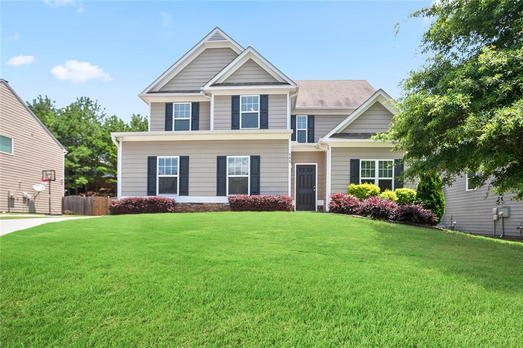 Exceptional Craftsman Style 4 bedroom 2 and a half bath residence with fenced backyard in sought after High Shoals subdivision. Built in 2015, this home offers a beautiful blend of style and function with its open concept floor plan.Vacant and Move-in ready with rich hardwoods, newer carpet, and fresh paint. The stately hardi-plank exterior, beautifully landscaped grounds, side entry two car garage, extended concrete driveway and fenced backyard make this the perfect home for comfortable family living and entertaining!
Upscale architectural accents and molding throughout including arched entryways to each main level room, wainscoting, window blinds throughout, and craftsman doors create dramatic and appealing living spaces. Main level features ; home office, open dining room, bright sun filled Chef's kitchen, breakfast room and fireside family room. Kitchen offers granite counters and backsplash, center island and full compliment of appliances. Upper level boasts 3 large secondary bedrooms with ceiling fans and large closets, full bath and laundry room, and exquisite Owners suite with two large closets and sumptuous bath with garden tub, separate shower and double vanity.
Completing the home is the inviting fenced backyard with patio and freshly seeded backyard. Great location with great schools, close to shopping, dining, local parks, hospitals, express lanes, and a short drive to trendy downtown Woodstock shopping, restaurants and entertainment.
Amenity option! Through a corporate membership agreement with the High Shoal's HOA’s management company, a BridgeMill Athletic Club membership is available at a reduced rate! Membership includes access to the pool, fitness center, group classes, playground, sand volleyball, basketball courts, pavilion, and a variety of kids and family programs.