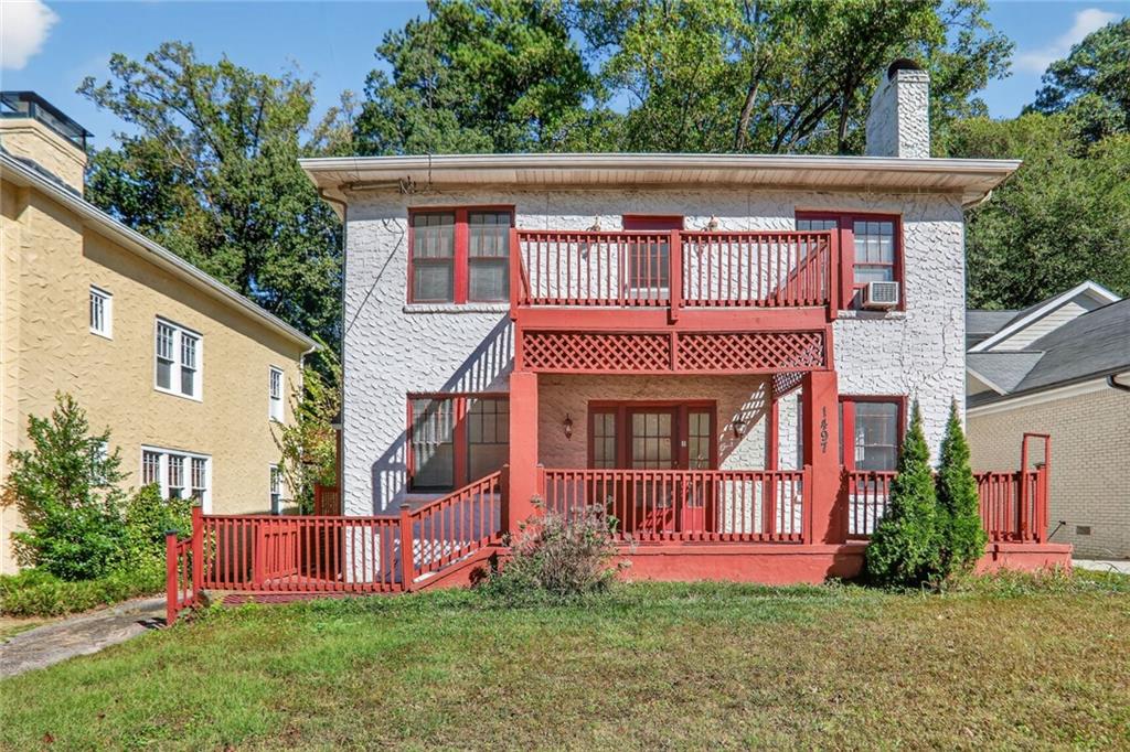 Classic Charm Meets Prime Intown Living – Two-Story Morningside Duplex perfect for conversion to single family home. Set on a level, grassy lot in the heart of Morningside, this
classic two-story stucco duplex catches the eye with bold red trim, double front porches, and undeniable curb appeal. The full-width porch
on the main level and private balcony upstairs are perfect spots to sip coffee, unwind, or wave to neighbors passing by. The home’s original
architectural details, mature landscaping, and wide front lawn give it a timeless presence. Tucked back from the street with a long
driveway and off-street parking in the rear, it offers the kind of privacy and convenience that’s hard to find this close to everything. Located
between Virginia Highland and Piedmont Park, you’re just a short stroll from the Morningside Village dining scene, including local favorites
like Alon’s Bakery, Whiskey Bird, Orme Park, and the BeltLine. Each unit includes two bedrooms, plus a flexible third room ideal for a home
office. The kitchens have been tastefully updated with islands and stainless steel appliances, while the separate dining rooms and living
spaces—with original fireplaces—add to the home’s charm. You’ll find beautiful parquet and hardwood floors throughout, in-unit laundry,
and both front and back decks for added outdoor living. Whether you’re looking to house-hack, invest, or live with extended family, this
duplex is a rare opportunity in one of Atlanta’s most beloved, walkable neighborhoods.