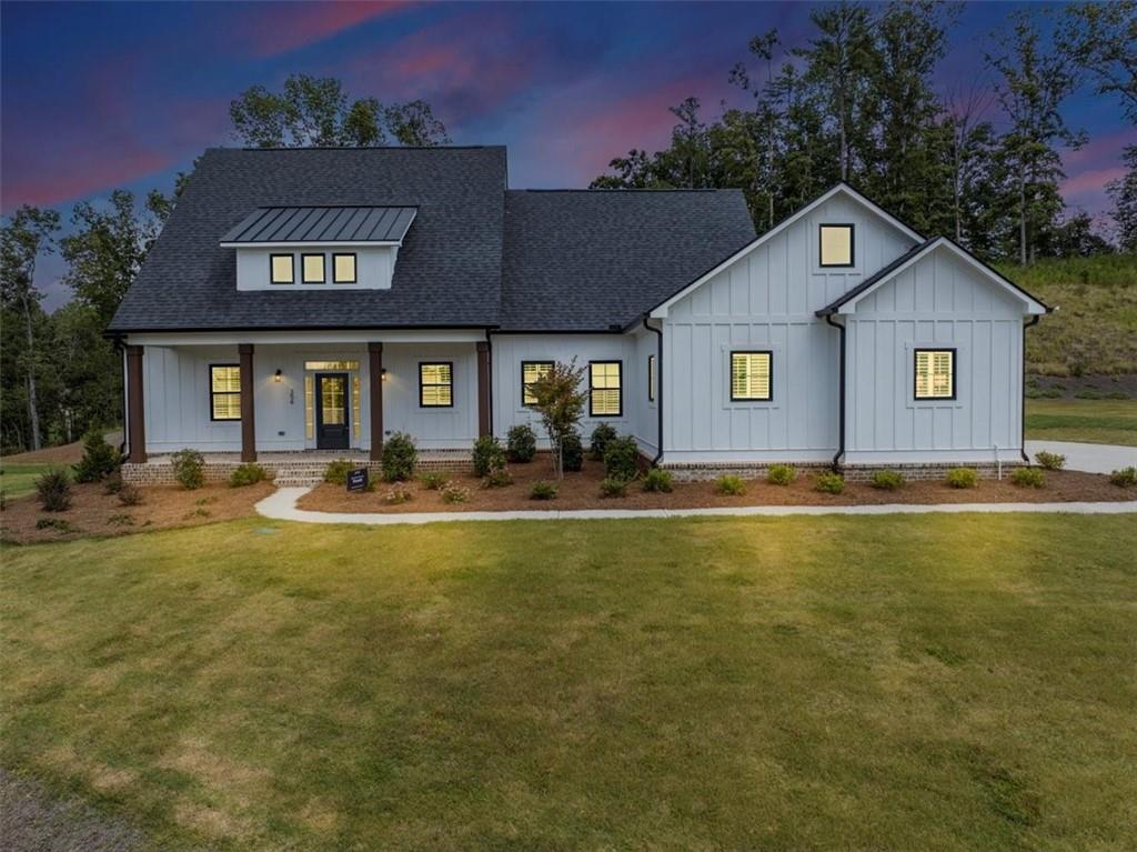 Discover refined living at 354 Oxford Road, a stunning Ball Ground estate where elegance and comfort converge. From the moment you enter, soaring
ceilings, expansive windows, and an open, light-filled layout create a sense of sophistication and ease.
The gourmet kitchen is a true centerpiece, featuring custom cabinetry, premium appliances, and a spacious island that flows seamlessly into the living
and dining areas—ideal for entertaining on any scale. The owner’s suite offers a private retreat with a spa-inspired bath and boutique-style closet, while
secondary bedrooms provide generous space and designer finishes.
Set on beautifully appointed grounds, this home offers the perfect blend of privacy and presence. Whether enjoying quiet evenings, hosting gatherings,
or envisioning future outdoor enhancements, 354 Oxford Road delivers a lifestyle of distinction in one of Ball Ground’s most desirable enclaves.