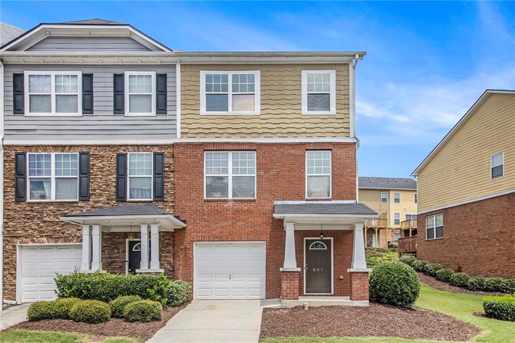 Welcome to this well-appointed 2-bedroom, 2.5-bathroom end-unit townhouse ideally located in a prime Lawrenceville location with unbeatable access to Hwy 316, I-85, the Mall of Georgia, and Sugarloaf Mills. This home offers the perfect blend of comfort, convenience, and low-maintenance living in a sought-after community with fantastic amenities. Step inside to an open and inviting floor plan featuring a spacious family room and dining area, perfect for entertaining or relaxing. The kitchen boasts stained cabinetry, quartz countertops, stainless steel appliances including a gas range, and a breakfast bar that seamlessly flows into the living space. Upstairs, you'll find two generously sized bedrooms, each with their own walk-in closet and private bath. The primary suite features a tray ceiling, double vanity, separate soaking tub and shower, and ample closet space. The laundry room is conveniently located on the upper level for added ease. The finished basement adds valuable bonus space with a flex room ideal for a home office, gym, or media area, plus a half bath for guests. Enjoy outdoor living and neighborhood strolls with community walking trails, a playground, and a sparkling swimming pool. The HOA maintains the exterior and yard, giving you more time to enjoy all this home and location have to offer. Whether you're a first-time buyer, downsizing, or looking for an investment, this move-in ready home offers the best of convenience and lifestyle in a thriving area.