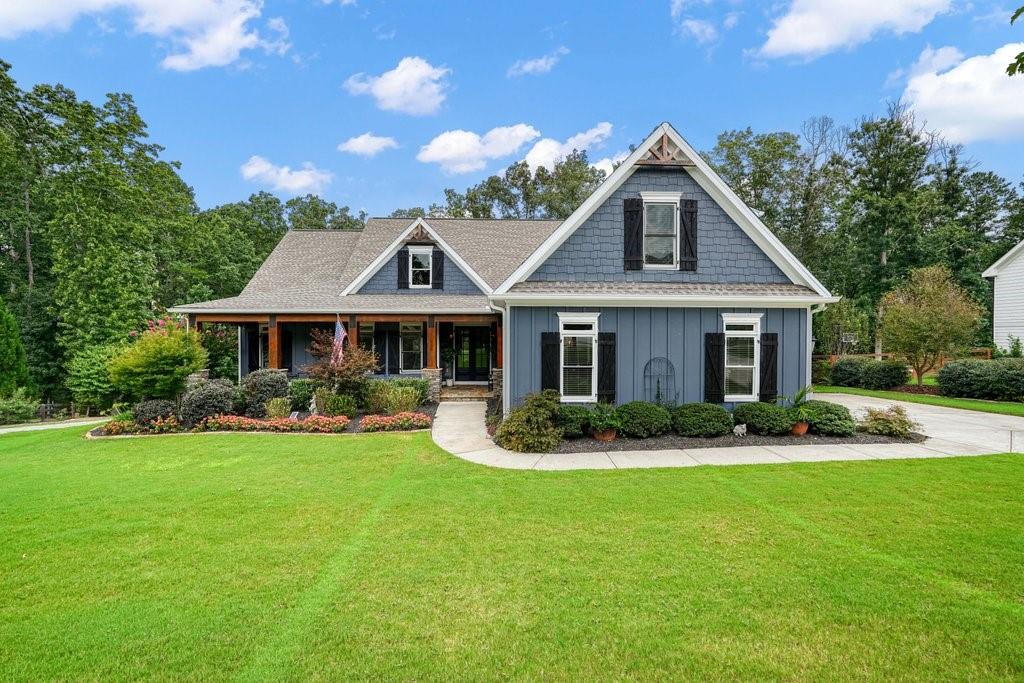 WOW Factor Ranch with Finished Basement and Bonus Suite in Cherokee County! The home has been pre-inspected for buyer confidence. Welcome to a home that truly has it all! This stunning ranch is set on a beautifully landscaped lot bursting with curb appeal, where lush greenery, including mature Japanese maples, create a private, park-like setting. Inside, you’ll find 5 bedrooms and 4 full baths, with thoughtful design that blends everyday comfort and unforgettable details. The main level showcases gleaming hardwood floors, a 72” rustic ceiling fan in the great room, and a dining room with a one-of-a-kind coffered ceiling featuring reclaimed barn wood inlays. The gourmet kitchen flows seamlessly into the living areas, making it the perfect backdrop for both entertaining and family gatherings. Upstairs, a private bonus
suite with full bath is ideal for guests, a teen retreat, or a quiet office. The area is pre-wired for a home theater system and includes 4 in-wall speakers. Downstairs, the finished basement is a home within a home—featuring two bedrooms, a full bath, a full kitchen, living room, and game room. This level also includes a rare tornado shelter, two oversized storage/work areas, and built-in LCD TVs that make it ready for fun and peace of mind. Outdoor living shines with a screened porch with stained-wood ceiling, a custom arbor, and a fully fenced, Zoysia-sodded backyard complete with a shed or outdoor living pad and a tree bench! Whether relaxing or hosting, this yard is a true retreat. And for the features you won’t find anywhere else: a Generac whole-house generator for uninterrupted comfort, a showroom-style garage with sealed floor and bright lighting, and Leaf Filter gutter guards for easy maintenance. All of this is located in the heart of Cherokee County, where you can enjoy a lifestyle of convenience and recreation. Just minutes away, spend your weekends boating at Lake Allatoona or Lake Arrowhead, hiking at Fields Landing Park, launching from Knox Bridge Landing, or enjoying Sweetwater Campground and Little River Marina. This isn’t just a home—it’s a lifestyle. Don’t miss the chance to make it yours!