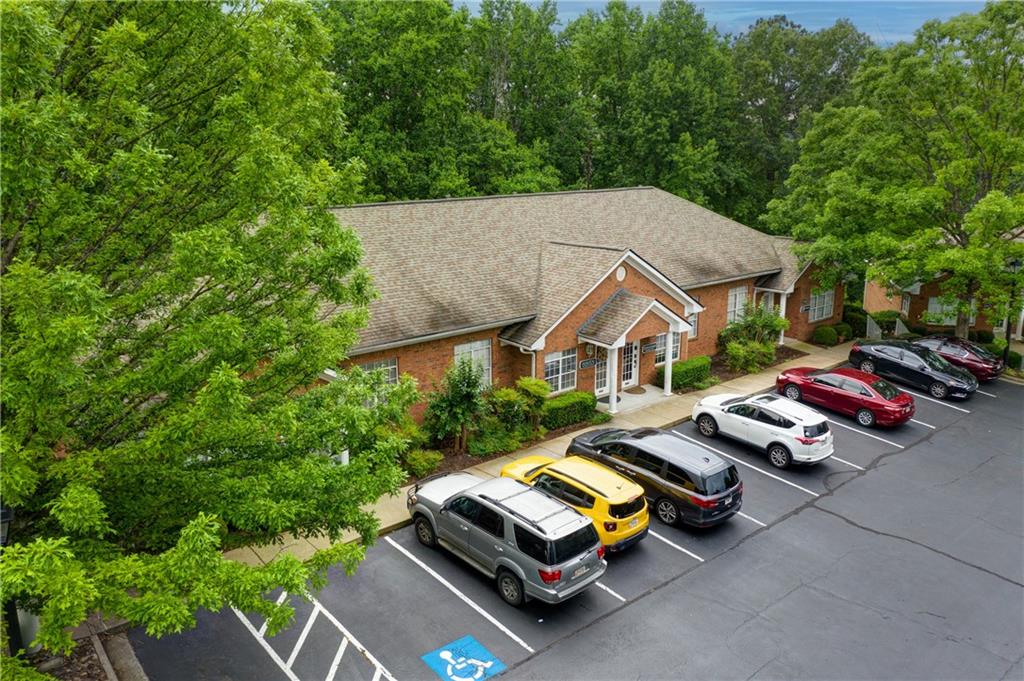 Don't miss out on this excellent investment opportunity in a high-demand area that is close to Downtown Woodstock!
This property is a one-story office building with a basement consisting of 8,800 +- Sq Ft of office space, it includes FOUR OFFICE suites, each with its own office rooms, reception area, conference room, kitchen and eating area, two baths and storage space and approx. 2,200 Sq Ft. All unis are recently renovated with new paint, flooring and lighting.
Each office suite is currently 100% leased with 2-4% annual base rent escalation, ensuring a steady revenue stream. Please, call the listing agent to ask questions about the lease rates, annual expenses to the Landlord, etc.
The CAM is $400 per month, paid by tenants and includes: normal water/sewage use, trash, interior sprinkler maintenance, lot and landscape maintenance and replacement insurance on the exterior of the building.
The location is incredibly convenient, providing easy access to HWY 92 and HWY 575, making it ideal for business seeking accessibility. The property has 18 dedicated parking spaces.
Don't miss out on this prime commercial property, offering both stability and growth potential. DO NOT DISTURB THE TENANTS!