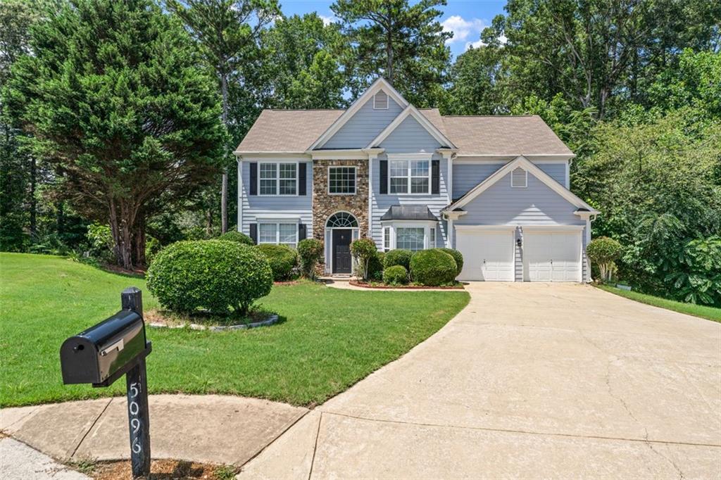 Located in a peaceful CUL-DE-SAC and JUST 3 MINUTE SHORT WALK FROM THE TOP RATED NORTH GWINNETT HIGH SCHOOL, this beautifully updated 4-bedroom, 2.5 bath home offers over 2700 square feet of modern living space in one of Suwanee's most sought-after swim and tennis communities. The home features new LVP flooring on the main level, newly updated kitchen with white cabinetry, 2 story Family Room that looks out to private wooded back yard, built-in bookshelves in a flex space with French doors that can be used as a 5th bedroom or an office, separate formal dining room, lots of natural light pouring into the inviting floor plan, the spacious master suite that offers a serene retreat, generously sized additional bedrooms with ample closet space, and much more! Whether you are relaxing at home or taking advantage of the nearby amenities (Settle Bridge Park, walking trails to the Chattahoochee River, Bear's Best Golf Course, just to name a few) this charming property offers both comfort and convenience in a prime Suwanee location. Don't miss out on this incredible opportunity--schedule your private showing today!