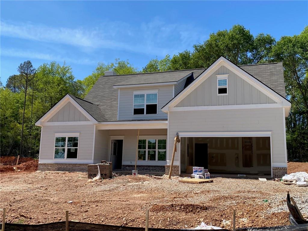 WILL BE READY FOR MAY MOVE-IN! 100% Financing Available with minimum 650 Credit Score - See Lender for more details. Up to $7,500 closing costs paid with preferred lender! Lot 2- The Georgia with Bonus Room - Our largest floor plan!! Main level features master w/his & her closets + additional guest bedroom. Covered front porch opens to foyer & dining room w/paneling. Eat-in island kitchen with tile backsplash views the vaulted great room. Rear covered porch overlooks the private, wooded backyard. Upstairs features LARGE bonus room + two secondary bedrooms w/double vanity bath + walk-in attic storage. Wood burning fireplace. ALL INTERIOR PHOTOS ARE STOCK PHOTOS.