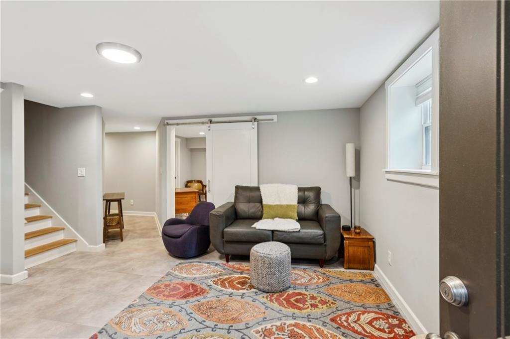 Sophisticated terrace-level apartment with private gated entrance. This fully furnished unit features a spacious master bedroom with walk-in closet and en suite bath with luxury walk-in shower. The shaker-style kitchenette/bar offers ample space with premium compact appliances and brand-new cabinetry providing generous storage. Enjoy a private paver patio with a fire pit in a quiet, upscale neighborhood. All utilities are included—water, power, gas, high-speed internet, lawn service, and trash pick-up. Please note there is no washer/dryer in the unit.
