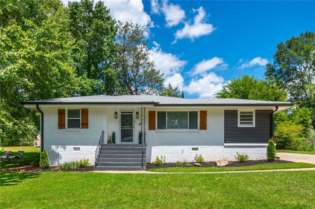 Welcome to 941 Shirley Street—a charming three-bedroom, one-bathroom brick ranch in the heart of Smyrna, freshly painted inside and out. Gleaming hardwood floors flow through the living spaces, creating a warm and inviting feel. Outside, the large fenced lot provides plenty of room to gather, garden, or relax in your own private retreat. The detached garage offers endless potential—convert it into a man cave, she shed, workshop, or use it for extra parking. This home’s location is unbeatable for professionals, first-time buyers, starter families, or investors alike. It’s situated in the top-rated King Springs Elementary School district and is minutes from major highways, making commutes to Atlanta and beyond a breeze. Enjoy easy access to the vibrant Smyrna Market Village, Truist Park, and local parks, as well as the Silver Comet Trail for biking and walking adventures. With its incredible location, flexible spaces, and classic charm, 941 Shirley Street is a fantastic opportunity for a cozy home or a lucrative rental in one of Smyrna’s most desirable neighborhoods.