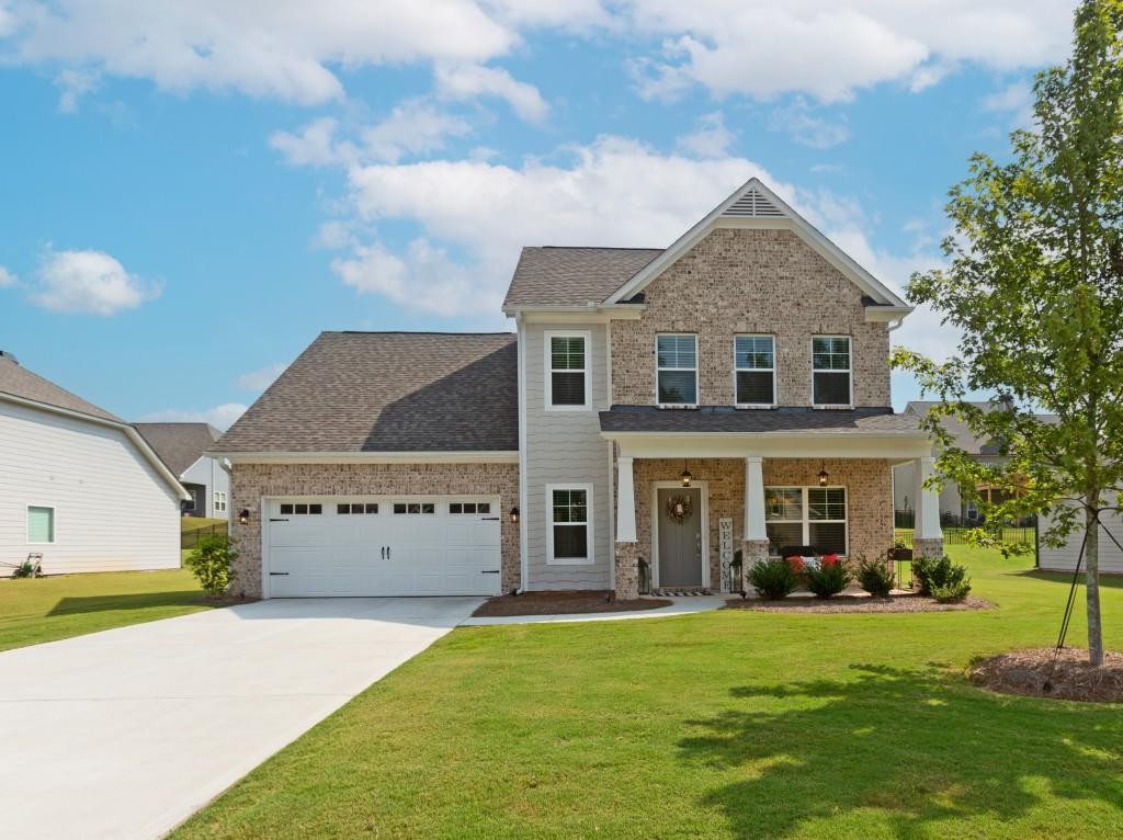 Looking to Move to a Golf Course Community? Don't miss this like-new Paran Home in sought-after Jefferson! Fresh interior & exterior paint, new carpet, and an open floor plan with 3 beds, 2.5 baths, master on main, loft, plus a large backyard with covered patio. The chef's kitchen features a very large walk-in pantry, granite countertops, white cabinets, stainless steel appliances, and a spacious island overlooking the family room with fireplace. Flexible separate dining room/office makes working from home or entertaining a breeze. Lifestyle & Amenities include the Olympic-sized pool with splash pad & waterslide, tennis, pickleball, golf, and countless community activities. Dine at the on-site Country Club Restaurant, Twenty7, or grab a drink. This luxury farmhouse offers the perfect blend of upscale living and an active golf community lifestyle. Top-rated schools, close to I-85, shopping & dining. Schedule your showing today!