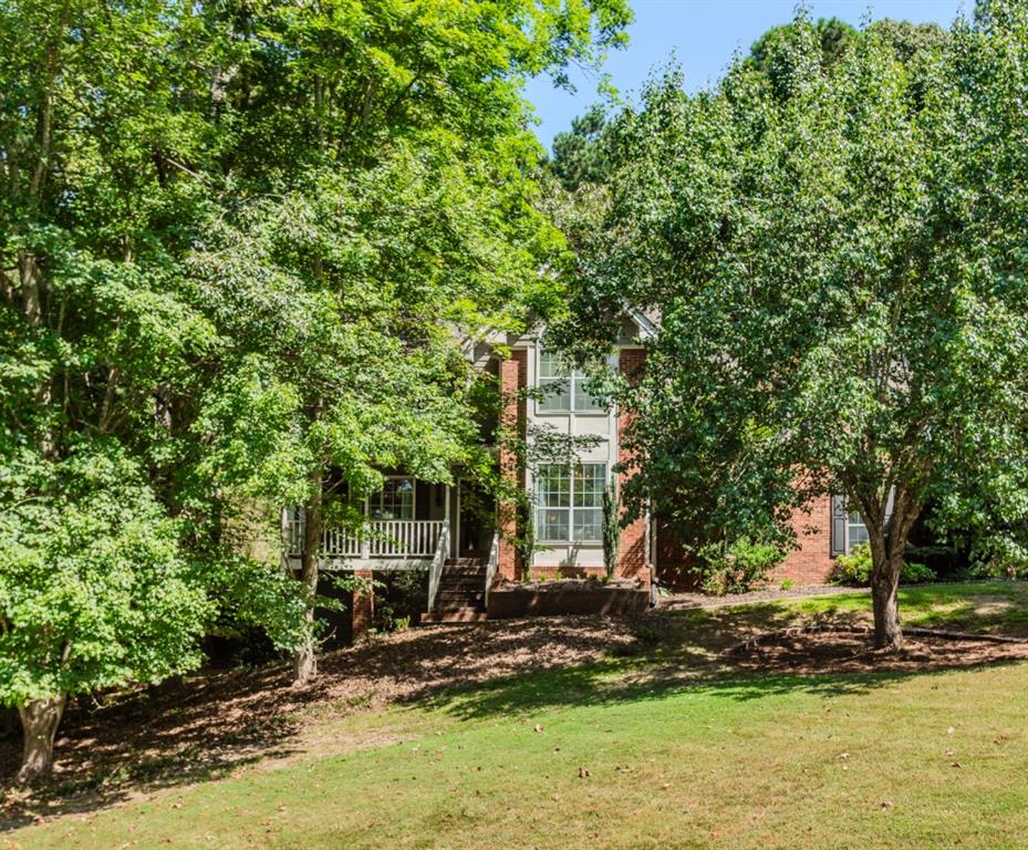 Calling All First-Time Homebuyers & Investors! Welcome to your opportunity to own in Walton County with no rental restrictions and an optional HOA! As you step inside, you're greeted by a formal dining room to the right perfect for gatherings and a spacious family room with a cozy fireplace to the left, ideal for entertaining. The kitchen boasts white cabinets, granite countertops, and a separate breakfast area, offering both style and functionality. Upstairs, you'll find an oversized master suite with a renovated bath featuring double vanities, a separate tub and shower, and a large walk-in closet. Three additional bedrooms and a full bath provide plenty of space for family, guests, or a home office. This home sits on a private 1-acre lot with a wooded backyard, offering peace and seclusion. Enjoy the versatility of a partially finished basement that's ready to entertain or become your personal masterpiece. Perfect as a game room with space for a pool table, home theater, or bar area or transform it into a private gym, studio, or retreat. With plenty of room to customize, this lower level adds endless potential to make the home uniquely yours. While it's priced to reflect the need for new flooring and interior paint, it presents a fantastic chance to customize it to your taste. Conveniently located near retail, restaurants, and Highway 78, this home offers both privacy and accessibility. Don't miss out bring your buyers and make an offer today!