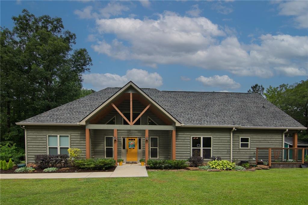 Harris County like new rustic home fronting 12 acre fishing lake on 6.88 acres. Featuring 3BR, 2BA, bonus room and open floor plan. Large kitchen with granite island with lake views. Large great room with wood cathedral celling and wood burning insert. Large master suite with beautiful tile shower. Enjoy covered porch with fireplace overlooking fishing lake.