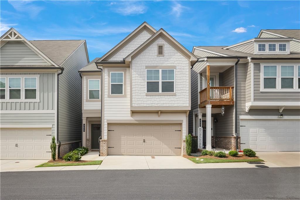 Ask us about a $7,000 grant toward your down payment and $1,000 toward closing costs with our preferred lender (no obligation to use).
Discover effortless living in this beautifully upgraded townhome, where style, comfort, and convenience come together. Say goodbye to yard work and hello to more free time with low-maintenance living.
The chef’s kitchen features sleek quartz countertops, a large island, and high-end appliances—perfect for both everyday meals and entertaining. The open-concept living area offers a cozy fireplace flanked by custom built-ins, adding charm and functionality.
Upstairs, the spacious primary suite is a true retreat with an oversized walk-in closet and a spa-like en-suite bath. Two additional bedrooms offer flexibility for guests, a home office, or whatever fits your lifestyle. All upstairs bathrooms include double vanities for added comfort.
Enjoy over $30,000 in builder upgrades, including hardwood stairs with modern handrails, a practical mudroom, and additional attic storage. The back patio is ideal for relaxing or hosting friends.
Located just minutes from Historic Downtown Woodstock, Target, Home Depot, Lowe’s, I-575, and Hwy 92—this home offers unbeatable access to shopping, dining, parks, and more.
Experience the perfect blend of thoughtful design and low-maintenance living—freeing you up to enjoy what matters most.