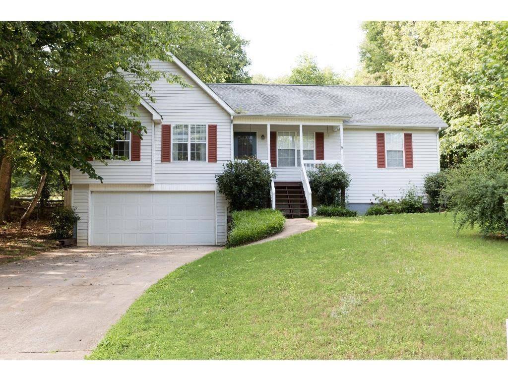 Immaculate ranch on full basement. Hardwood floors thru-out. Split bedroom plan, cathedral ceilings in great room and master suite. Huge unfinished basement ideal for workshop and tons of storage. Private fenced backyard with deck, rocking chair front porch, excellent location within one mile of GA 400 and exit 16.