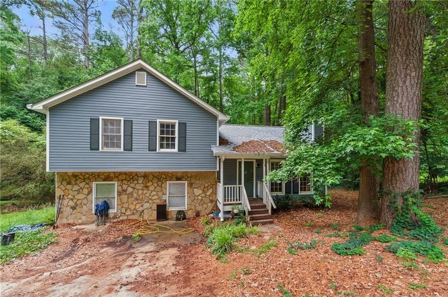 Discover the perfect blend of comfort, convenience, and opportunity in this charming split-level home located in desirable Powder Springs. Featuring 4 bedrooms and 2 bathrooms, this spacious property is ideal for first-time buyers or savvy investors seeking a great addition to their rental portfolio.
Natural light floods the living room through large windows, creating a warm and inviting atmosphere. Just off the living room, the kitchen offers plenty of space for meal prep and casual dining—ready for your personal touch and updates. The expansive, private backyard is perfect for entertaining, complete with ample room for gatherings and a large storage building for added convenience. The lower level boasts a versatile bonus room, ideal for a game room, home theater, or extra bedroom, along with a laundry room that offers easy access without disrupting the main living areas. Sold as-is with no disclosures, this home presents a great opportunity for cosmetic updates and personalization. Major components like the roof, HVAC, and siding have already been replaced in recent years, providing a solid foundation for future improvements. With no rental restrictions, this home is a fantastic option for homeowners and investors alike.
