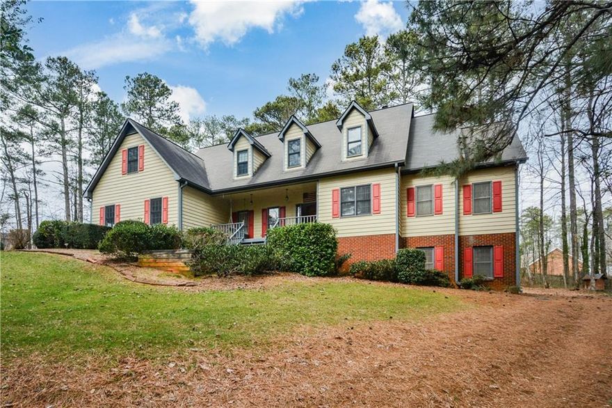 This stunning custom built home that sits on a secluded 3.01 acres with more acreage available is an excellent value in a highly sought -after East Cobb location with easy access to freeways. The 1000 foot driveway to your new home allows you to enjoy the peaceful front porch, back deck, chicken coop, treehouse, fire pit and garden in the privacy of your extensive wooded acreage. You will find tasteful updates in this move-in ready home from the partially finished, air conditioned basement and up-dated chef's delight kitchen with large walk in pantry, 4 ovens, stainless steel appliances and granite counter-tops. There is plenty of room in this spacious home for you all to enjoy and bring it into the 21st century. The main floor has added hardwood floors with the updated kitchen, breakfast nook and laundry room.  The open concept vaulted living space has a 2nd floor indoor balcony with hardwood floors overlooking the 1st floor, a banquet sized separate dining room, built-in shelves and a half bath. The primary suite located on the main floor includes a fireplace, built-in shelves and plenty of closet space with 2 separate walk-in closets. The spacious primary bath has a private water closet, his and her vanities, a walk-in shower and 2 person jacuzzi tub. Behind the master closet is a large room that could be a nursery, office or extra storage space. An enclosed Sun Room/Reading nook/bar has been added to the back deck with bright, large windows that provides a wonderful place to gather. Upstairs you will find the other 4 large bedrooms with updated carpet and ample closet space in each and Jack and Jill baths. There is hallway access to 2 bedrooms with 3 hallway closets. There is indoor balcony access to the other 2 bedrooms and a 2 story attic. A 2 car garage on the main level and a driveway accessible garage door on the basement level for a car or for storage. The full basement gives you plenty of storage or an option for more living space. Plenty of parking space for RV's, a boat or utility trailer. Home security system included. Come and enjoy this relaxing home tucked away private setting by scheduling your appointment today.