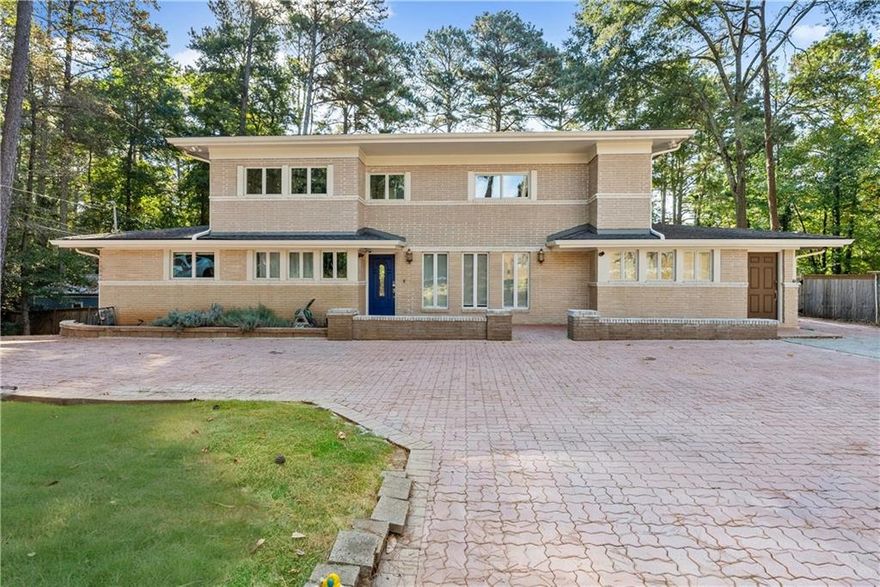 This house offers a wonderful balance of space, privacy, and everyday comfort on a beautiful one-acre lot in the heart of Sandy Springs.

Recently refreshed with a newly painted interior, this inviting home welcomes you with mature landscaping, a wide front driveway, and plenty of parking for family and guests. The setting feels peaceful and private while still close to everything that makes Sandy Springs so desirable.

Inside, the open main level flows easily between the family room, dining area, and kitchen, creating a comfortable layout for both daily living and entertaining. The chef’s kitchen features a Wolf range, premium stainless-steel appliances, and a large island with seating that naturally brings people together. Abundant windows fill the space with natural light and provide views of the expansive backyard, connecting the indoors with the outdoors.

The primary suite on the main level offers comfort with a spacious bath that includes dual vanities, a spacious walk-in shower, a soaking tub, and a generous custom closet. Upstairs are three additional bedrooms, two with ensuite bathrooms, providing flexibility for family, guests, or hobbies.

The 5th room is a home office suite with its own full bath overlooks the backyard, offering an ideal setup for remote work, creative projects, or private guest quarters. The finished terrace level adds even more versatility, featuring a recreation room, a kids’ climbing wall, and a full bath. With direct access to the backyard, this area works well for casual entertaining, fitness, or a play space.

The backyard is the true highlight of this house and where the home really shines. 

Designed for both relaxation and fun, it includes a relatively new heated saltwater pool, with a spa, a spacious patio for outdoor dining or lounging, and a fire-pit area perfect for evenings under the stars. The children’s playground provides a safe place to play, and the large open lawn offers plenty of room for pets, sports, or gatherings. Surrounded by mature trees and privacy fencing, the space feels peaceful and secluded. Two storage sheds provide convenient space for tools and pool equipment.

Practical updates add to the home’s appeal. A whole-house natural gas generator provides peace of mind during power outages, and updated systems throughout ensure reliability and comfort. The expanded driveway makes parking easy for multiple vehicles.

With NO HOA, homeowners have the freedom to enjoy and personalize the property as they wish which is a rare advantage in this part of Sandy Springs.

The location is one of the best features. The home is just minutes from GA-400 Exit 6, offering quick access to Sandy Springs, Dunwoody, Roswell, and downtown Atlanta. Excellent private and public schools are nearby, along with a wide range of restaurants, shops, parks, and entertainment. 

Outdoor enthusiasts will appreciate nearby access to the Chattahoochee River, golf courses, and scenic walking trails.

1495 Spalding Drive is a an inviting retreat in the heart of Sandy springs that combines generous space, a beautiful backyard oasis, and an ideal location. It’s a property that offers the best of both worlds: privacy and room to spread out, with convenience and community close by.