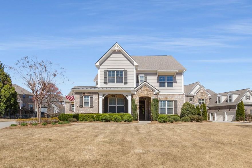 Stunning 4-Bedroom Home in Prestigious Mabry Manor. Welcome home to this meticulously maintained four-bedroom, four-bathroom residence in the highly sought-after Mabry Manor community. Nestled in East Cobb's top-rated school district and just minutes from premier shopping and dining, this home offers the perfect blend of luxury and convenience. Step onto the welcoming front porch and into a foyer that instantly feels like home. The main level is bright and airy, with 10-foot ceilings and large windows that flood the space with natural light. Beautiful 5-inch wide plank floors add warmth and character, while a versatile front room perfect as a dining area or home office features charming details like crown molding, chair rail, and wainscoting. The cozy family room invites you to relax by the fireplace, framed by built-in shelving for a touch of charm and functionality. Hosting is a breeze with a convenient wine bar and butler's pantry. At the heart of the home, the kitchen is designed for gathering, featuring painted cabinetry, a spacious granite island with seating, elegant granite countertops with a tile backsplash, high-end KitchenAid appliances, and a sunny eat-in area perfect for enjoying morning coffee or casual meals with loved ones. The primary suite with a vaulted ceiling, conveniently located on the main level, is a true retreat with a spa-like bath, garden tub, double vanities, and a separate tiled large shower. There is ample storage with spacious walk in closets. Upstairs, you'll find three additional bedrooms and a flexible bonus room, perfect for a playroom, media space, or home office. Step outside to your private terrace overlooking a beautifully landscaped yard with a charming arbor an ideal setting for relaxation or outdoor gatherings. Additional features include a main-level laundry room and generous attic storage. The 2-car garage offers easy access to the kitchen and main level. Mabry Manor is a vibrant swim and tennis community, offering exceptional amenities and a welcoming neighborhood atmosphere. Don't miss this incredible opportunity to make this stunning home yours!