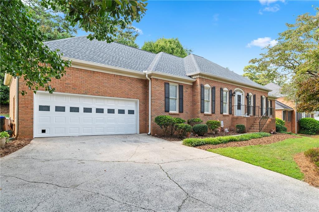 Welcome to this impressive 3 bedroom, 3.5 bathroom brick ranch that combines comfort, functionality, and timeless charm. Situated in a desirable Roswell community, this home offers abundant space inside and out, along with access to fantastic neighborhood amenities.
From the moment you arrive, you’ll notice the thoughtful details—three garages, two designated driveway parking spots, a brand new roof (October 2024), brand new water heather (August 2025) and a Rain Bird sprinkler system that makes maintaining the landscaped yard effortless. Inside, the heart of the home is the expansive kitchen featuring an eat-in area, new cooktop, new garbage disposal, a breakfast bar, and plenty of cabinetry for storage. You will also find your own private full bath in one of the secondary bedrooms. The adjoining living room is warm and welcoming with its cozy brick fireplace and a private wet bar, creating the perfect gathering spot.
The oversized primary suite provides a private retreat with a spa-like ensuite boasting double vanities, a large soaking tub, and a separate shower. Two spacious secondary bedrooms and additional bathrooms ensure comfort for family and guests. The unfinished basement presents incredible potential—whether you need abundant storage or envision a future recreation room, gym, or media space.
Step outside to enjoy a private backyard oasis, ideal for entertaining or relaxing. The community offers resort-style living with access to a pool, tennis courts, pickleball, a clubhouse, and a playground.