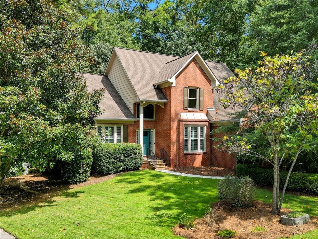 COMING SOON! WELCOME TO THIS RARE GEM – a beautifully maintained 4-bedroom, 3.5-bath home in the highly desirable swim and tennis community of Carriage Oaks! Meticulously maintained with numerous upgrades, this home greets you with a soaring 2-story foyer perfectly balanced with a bright office to one side and a welcoming dining room to the other, flowing into a vaulted living area with a stacked-stone gas fireplace. Custom plantation shutters add timeless elegance throughout most rooms of the home. The chef’s kitchen features a new stainless steel range, oven, microwave, refrigerator, oak cabinets, farm sink, newly updated pantry, porcelain brick tile floors, and a bright breakfast bay window and connected to a renovated sunroom overlooking peaceful wooded views.. The main-level updated primary suite offers a tray ceiling, large walk-in closet, and a spa-like bath with French doors, travertine floors, a water closet, new tile shower with pebble waterfall, garden tub, and marble double vanity. Step outside to the new 2017 expansive outdoor cedar deck freshly stained with a BRAND NEW custom rock wood-burning rock fireplace and serene forest backdrop. Upstairs includes three bedrooms with new carpet, a full bath, loft, and walk-in closets, while the finished terrace level boasts a library/study, ventless gas fireplace, potential 5th bedroom, kitchenette, full bath with jacuzzi tub/shower, karaoke/gym room, media room with surround sound, abundant storage, and a large “secret room” that doubles as a playroom. A newly installed (2023) exterior stairway connects the terrace level to the driveway. The beautifully landscaped yard features Meyer zoysia, stone and pebble pathways, raised planters, a fairy garden, irrigation, and an outdoor shower with hot water—perfect for pets. Exterior brick and hardboard siding ensure low maintenance, complemented by many upgrades: new paint and flooring, 2024 Trane HVAC on main, 2023 Rinnai tankless water heater, 2019 garage doors, 2023 pantry and laundry shelving, 2024 porch enclosure, 2016 primary bath remodel, 2021 sump pump, 2016 windows (vinyl interior/metal exterior), new 2016 doors, 2020 gutters/downspouts, and 2022 carpet upstairs. Conveniently located in a top-rated school district near Marietta Square, sports and concert venues, and within walking distance to Kennesaw Mountain National Park, this private cul-de-sac home truly has it all—LOCATION,UPGRADES, SPACE, AND SERENITY!