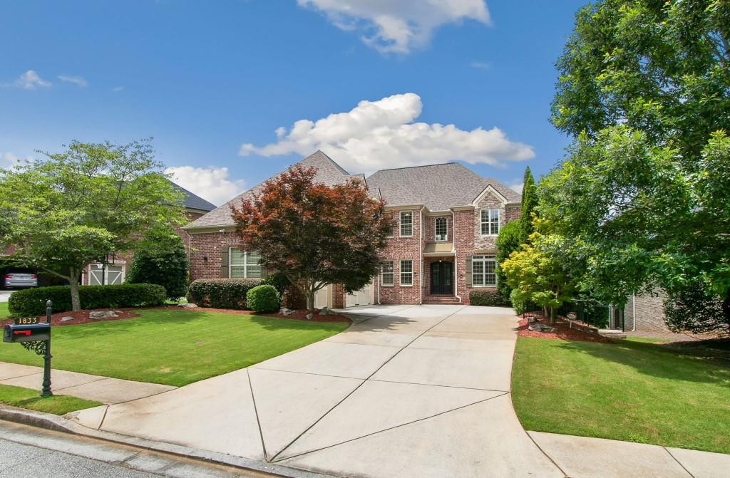 Welcome to 1833 Lake Ebenezer Trail N-where lakefront luxury meets inspired custom living in one of East Cobb’s most sought-after communities. Perfectly positioned on the water in Ebenezer Farm, this stunning 5-bedroom, 4.5-bath executive home is a rare opportunity to own a thoughtfully upgraded retreat that feels like a private resort. From the moment you step inside, you’re greeted by soaring ceilings, fresh paint, and newly installed smart home features including smart lighting and smart thermostats that elevates every room with modern elegance. The expansive chef’s kitchen flows seamlessly into gracious living and dining areas, setting the stage for unforgettable gatherings. Love to entertain? The custom-built home theater and extended back deck-overlooking the tranquil lake offers the perfect setting for movie nights, summer barbecues, and serene mornings with coffee in hand. Long driveway perfect for hosting events and gatherings. The seller has spared no detail, with a brand-new roof (installed less than 3 months ago), refined finishes throughout, and meticulous care that’s evident in every corner. Upstairs, the oversized primary suite offers a peaceful sanctuary complete with its own fireplace, spa-like bath and personal walout balcony facing serene lake views. Downstairs, a fully finished terrace level provides even more space for guests, recreation, or multi-generational living. Step outside and enjoy the sights and sounds of lake life from your own backyard, or take advantage of community amenities including swimming, tennis, and clubhouse. Located in the award-winning East Cobb school district and minutes from shopping, parks, and dining, this is more than a home-it’s a lifestyle. Don’t miss the chance to own one of the few lakefront properties in this coveted neighborhood
