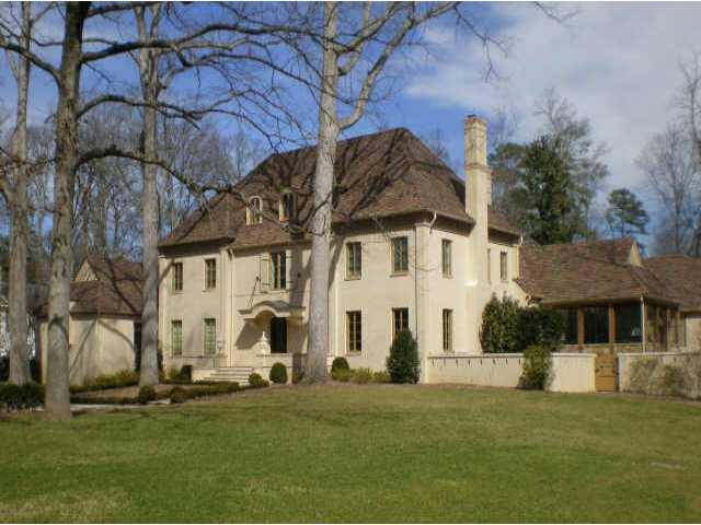 Concrete stucco on brick. Unmatched in quality and design. Redesigned by Stan Dixon and totally rebuilt in 2009 with finest finishes and craftsmanship. Extremely livable with master on main, large public rooms, tons of natural light. Fabulous lot on most desireable part of Habersham.