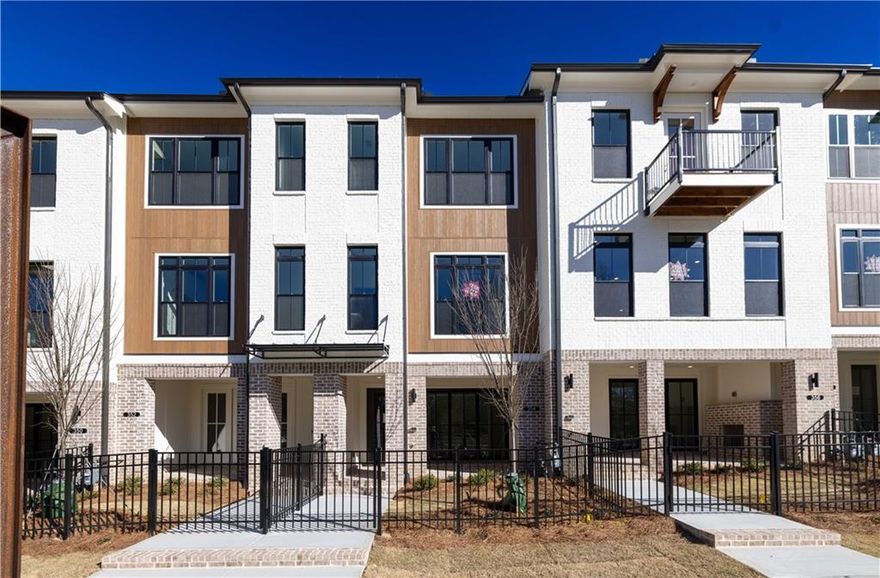 SUMMER OF SAVINGS - $20,000 ANY WAY YOU WANT ON ALL CONTRACTS WRITTEN BY THE END OF JUNE. Come visit us at Ecco Park in Alpharetta & Elevate your lifestyle in the exquisite Barnsley I featuring 2 Bedrooms and 2.5 Baths. This Townhome offers a blend of luxury and functionality, making way for comfortable living. Homesite 27 has high end finishes, thoughtful design and an outdoor space for entertainment. Enter through a COVERED PATIO and fenced front yard equipped with irrigation system for low maintenance living.  As you enter the front door, you step inside to a MEDIA/FLEX ROOM with SLIDER DOOR that opens to the covered, brick patio - the perfect indoor/outdoor space. Take the stairs to the Open Concept Kitchen, Family Room & Dining Area. This gorgeous Kitchen is designed with our Cool Linen Design Package featuring creamy white Quartz Countertops, 42" White Cabinets with Crown molding and Soft Closing Doors, GE Stainless Steel Appliances, Gas Smart Range, Built in Microwave, Dishwasher and Range Hood. 2 islands in this kitchen - an L shaped island for casual dining and a 2nd island gives you more counterspace for breakfast/dinner prep.  A large window in the kitchen and 2 windows and french doors in the family flood the main floor living space with tons of light. Step out to the deck just off the family room to enjoy your morning coffee or evening cocktail. On the upper floor, your primary bedroom haven awaits. The spacious primary bedroom has a tray ceiling and a luxurious spa like bath. The large tile shower with frameless door, and a double vanity with marble countertop finish the space. Down the hallway is a secondary bedroom and full private bathroom. This home is perfect for a roommate situation. One car garage with Electric Charger with more parking space on the Driveway and several unsigned spaces throughout the community. Prime Location as you can walk to major Shopping Centers, Best Buy, Target, several restaurants, Cava, Lazy Dog, Buffalo's Wings, Cheesecake Factory just to name few. Primary Care and Dentist Office are across the street. [The Barnsley I]