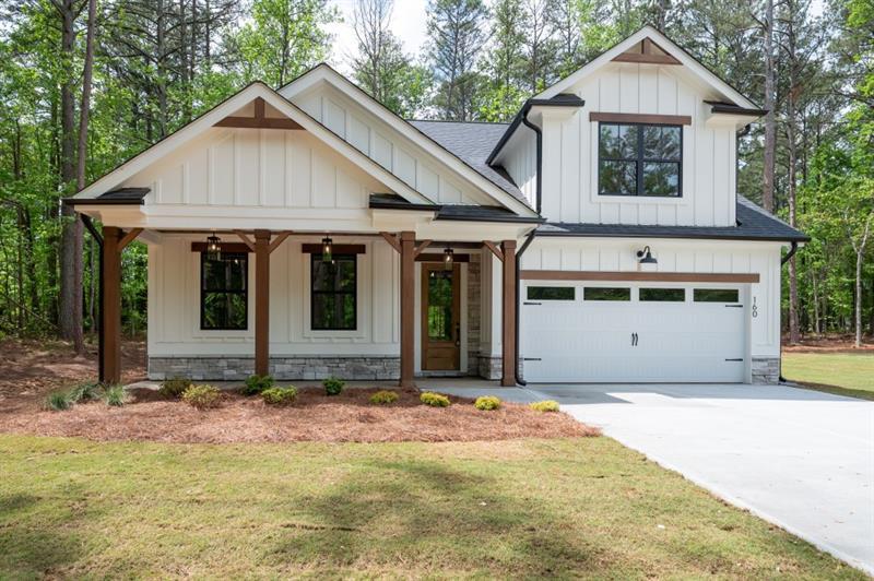 Beautiful new construction nestled on a quiet cul-de-sac lot. An enclave of eight custom homes on 1 acre lots and no HOA. This Open floorplan has 3 bedrooms and 2 bathrooms on main and 1 additional bedroom and bathroom upstairs. Convenient laundry room off master. Master bathroom features a double vanity, large shower with corner bench and niche. The kitchen boasts white cabinets, granite countertops, tile backsplash, kitchen island all open to the family room. You will appreciate the modern lighting and fixtures throughout the home. This home is total electric with gas starter for the fireplace and an option of gas cooking and gas grill connection. Outside you will enjoy relaxing on the covered porch or grilling on the patio. Convenient to the Roses store and Hwy 120 intersection across from Union elementary school. Map location in FMLS is incorrect.