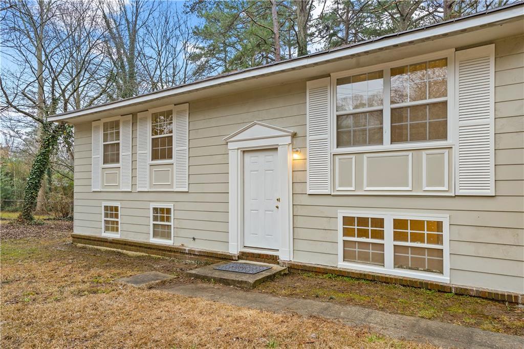 Charming Split-Level Home in Riverdale – Fully Renovated Basement! Welcome to this beautifully updated 5-bedroom, 2.5-bathroom split-level home in the heart of Riverdale, GA! Situated on a .26-acre lot, this 1,850 sq. ft. home offers modern upgrades while maintaining its classic charm. Step inside to find hardwood floors throughout the main level, leading to the kitchen featuring new granite countertops and ample cabinet space with abundant natural lighting with the large kitchen windows. The upstairs bathroom has also been upgraded with a new sink and cabinetry. The fully renovated basement provides extra living space, featuring two spacious bedrooms and one and a half bathrooms! Built in 1964, this home boasts solid construction while offering contemporary upgrades for today’s lifestyle. Enjoy the convenience of a split-level design, giving you flexible living spaces and privacy. The spacious backyard is ideal for entertaining, gardening, or simply relaxing outdoors. Located in a quiet neighborhood less than 5 minutes away from Southern Regional Medical Center, shopping, dining, and major highways, this home is a must-see! Don’t miss out on this move-in-ready gem—schedule your showing today!