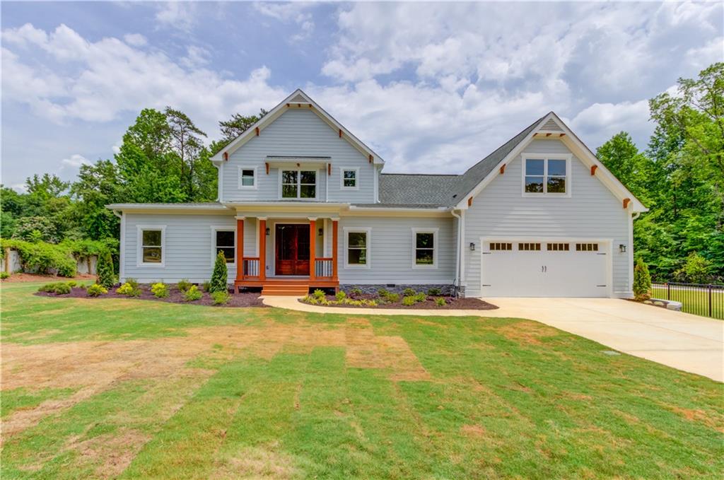 NEW CONSTRUCTION WITH DOUBLE SLIP DOCK ON DEEP WATER!  Come enjoy the beautiful north end of Lake Lanier as you relax on your double slip dock on big open water with no docks nearby.  Level lot with a nice walkway wide enough to drive your golf cart to the dock.  You will love the curb appeal and custom finishes in this new construction home.  As you walk in the front door you will instantly feel at home in the large foyer that flows to the open concept floor plan.  Master on main with a beautiful custom tile bathroom and large walk-in closet with built ins.  The gourmet kitchen has floor to ceiling cabinets, marble counters and high-end stainless appliances by Thor.  The main level has a large mud room with built ins and a large laundry room with cabinetry, sink and custom shelving.  Upstairs you will find two large secondary bedrooms with en-suite tile bathrooms and large closets with custom shelving.  The bonus / flex room on the second level provides plenty of space to enjoy lake life with friends and family.  The oversized garage has ample room to store a boat, lake toys and golf cart.  Additional features include spray foam insulation, epoxy floors in the garage, marble counters in kitchen and all bathrooms, and custom tile work in all bathrooms.  Come enjoy lake living this summer! Owner/Agent.