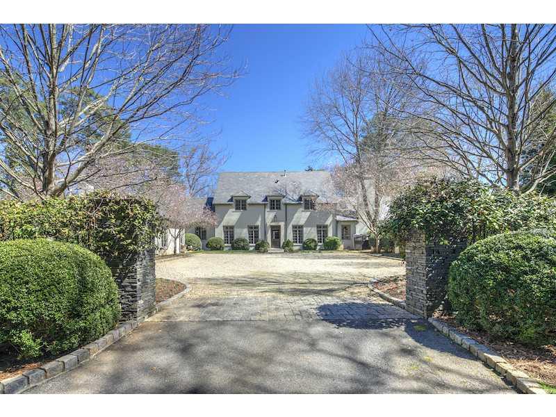 Renovated English country home by Yong Pak has made this one of the most inviting homes in the heart of Buckhead* 1.7 manicured acres.*Custom details and finishes throughout*Top of the line kitchen opens to the b'fast room w/custom iron doors & windows has sweeping views of the backyard* Fireside family room w/ vaulted beamed ceilings opens to the kitchen, a screened porch & walled stone patio* Beautifully appointed living room centered around a fireplace*Office* Master w/ marble master bath* Finished lower level* Light filled dining room seats 12* Rare opportunity.