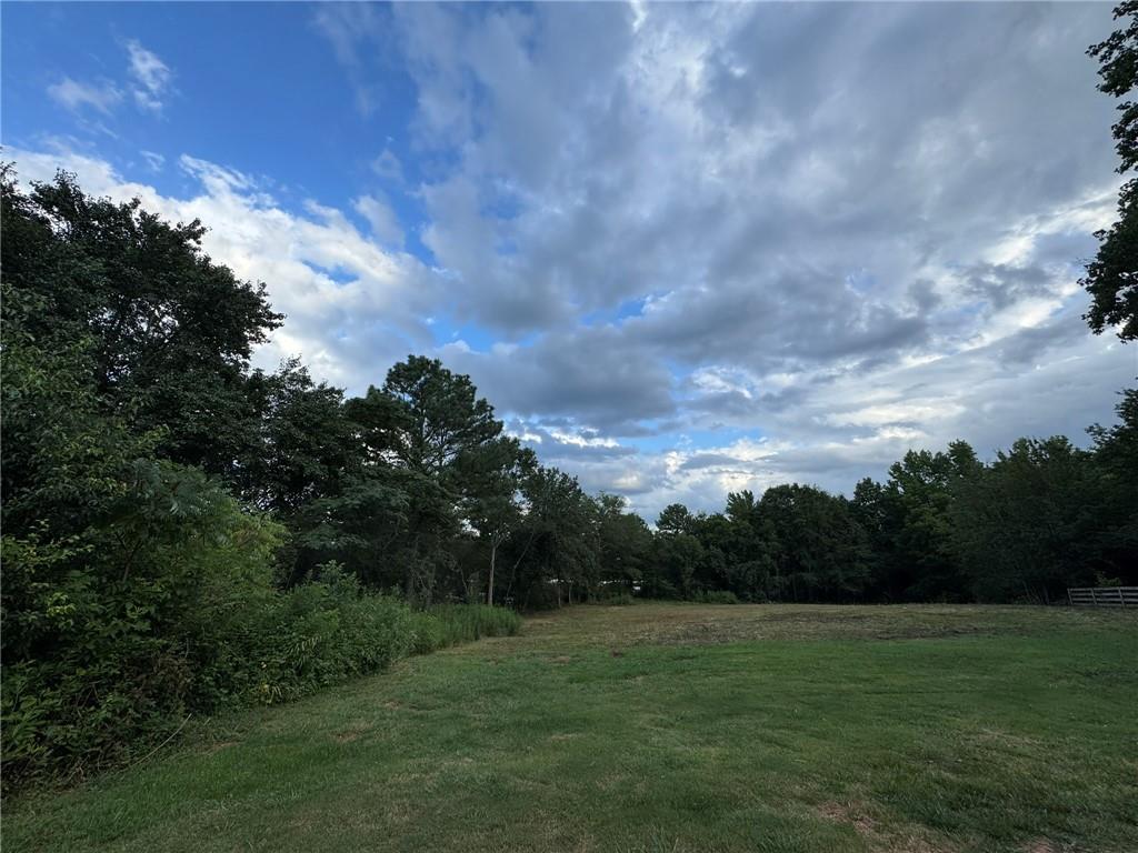 **Rare Investment Opportunity in the Heart of Cumming**
Welcome to a unique real estate opportunity at 516 Kelly Mill Rd, where your investment dreams can take shape on an expansive 0.77-acre lot! This prime piece of land is perfectly situated in a rapidly growing area and offers incredible potential for developers, investors, or those seeking their own slice of paradise.
This property stands out as a rare find. What makes this listing even more compelling is its proximity to the adjacent 0.23-acre parcel currently on the market; together they present a unique opportunity to expand your vision in this highly desirable location. The adjacent home was originally designed as an office, presenting further options for those looking to diversify their portfolio or enhance local business offerings.
With its ideal setting and unmatched potential, 516 Kelly Mill Rd is not just land; it’s an invitation for savvy investors ready to capitalize on.