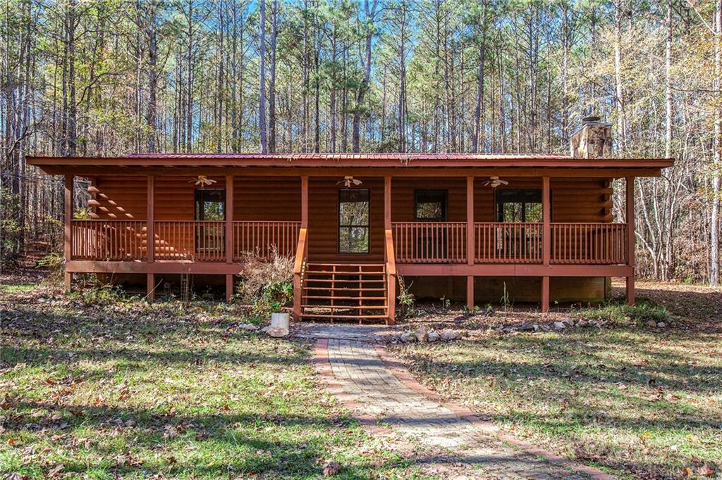 **Back on market at no fault of seller. Inspection and repairs completed including well inspection and water test** 3BR, 2BA ranch home with full length covered porch on front and covered porch in the back. No HOA, beautiful 5.1 acre tract with room for an additional home. Three large outbuildings. Home has been re-sided and well cared for. Need open space, no HOA, out building w power and still close to Newnan, I-85, Airport, and Studios. Do not miss this one!