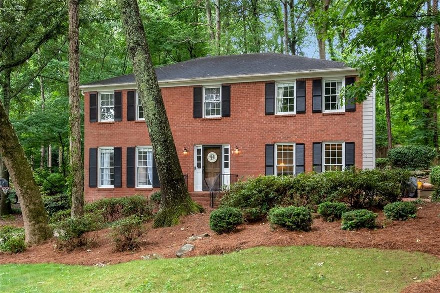 This beautiful brick-front home located in the Lake Colony swim tennis neighborhood offers 4 bedrooms and 2.5 baths, as well as a new kitchen, original parquet floors, spacious decking for entertaining, mature landscaping, a firepit area, and all within the Mount Bethel, Dickerson and Walton school districts.  The new white and grey kitchen, offers quartz counter tops, double ovens, gas cook top , and plenty of cabinet space. The adjoining dining room has built-in cabinets with quartz counters which add additional room for storage, or a fun bar area. The upstairs master suite is spacious with a large walk-in closet, there are three additional bedrooms, a bath and laundry room to complete the floor. The front yard offers both amazing curb appeal and a flat play area, or entertaining space. The back deck sits among the beautiful hardwoods, and with the bistro lights on, is a perfect place to spend an evening with friends.