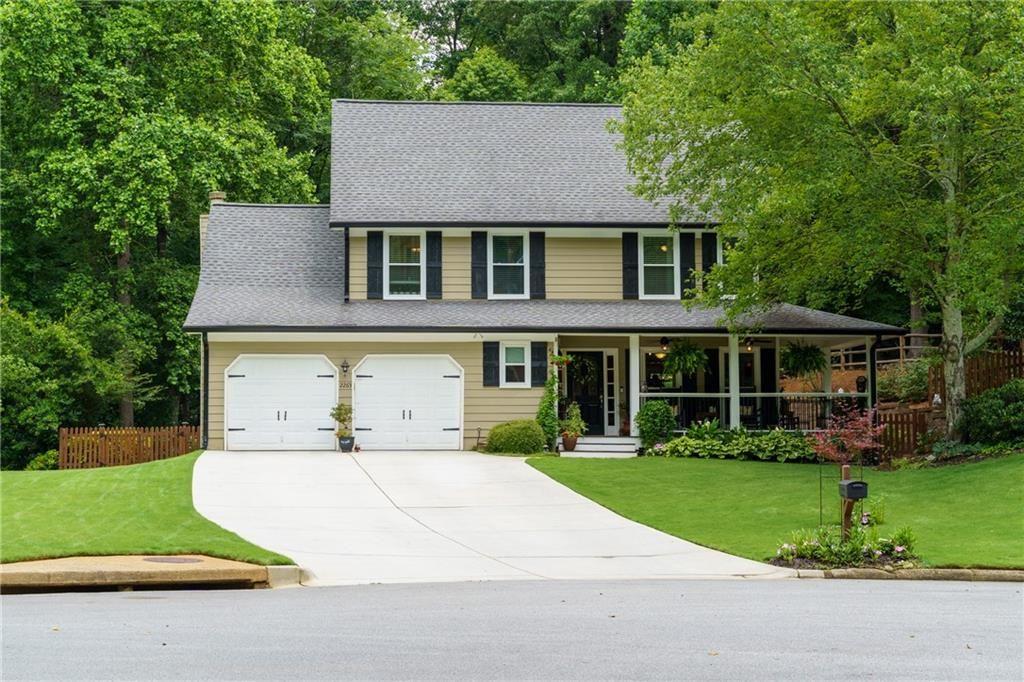 Welcome to your dream home in the heart of East Cobb’s coveted Northwoods section of Heritage Trace—where elegance meets comfort, and every detail is designed for living well. Zoned for top-rated Walton, Dodgen, and Timber Ridge schools, this beautifully updated home offers the full package: prime location, modern updates, and timeless Southern charm. The inviting rocking chair front porch sets the tone, overlooking a peaceful cul-de-sac and surrounded by lush greenery and colorful blooms that create a picture-perfect first impression. Step inside to discover a thoughtfully renovated interior with over $200K in updates and professional landscaping since 2020. The spacious, light-filled living areas flow seamlessly, featuring newer LVP flooring, smooth ceilings, and updated lighting throughout. The kitchen has been fully remodeled with 42” cabinetry, granite countertops, stainless steel appliances, and tasteful fixtures—offering a fresh, functional space ideal for both casual meals and entertaining guests. The adjacent dining area is bathed in natural light, with large windows framing serene backyard views. You'll find multiple gathering spaces throughout—indoors and out—including a lush, fenced backyard retreat with Zeon Zoysia lawn, custom retaining walls, paver walkways, a rebuilt deck, cozy fire pit, and blooming garden beds that make the outdoors feel like your own private sanctuary. There's even a storage shed, and the property line extends beyond the fence all the way to the Roswell border, offering more space and privacy. Back inside, the primary suite is a peaceful oasis, featuring dual walk-in closets and an elegant ensuite bath. The oversized second bedroom and comfortably sized third bedroom offer flexibility for family, guests, or a home office. A custom laundry nook with sliding barn door adds both charm and convenience. Modern upgrades include double-pane windows, two newer HVAC systems, newer roof, new driveway, and a garage wired for EV charging—ensuring peace of mind for years to come. Heritage Trace offers active swim and tennis amenities with some of the lowest HOA fees in East Cobb, and you're just minutes from top-tier shopping, dining, parks, and the charm of downtown Roswell. This home is more than move-in ready—it’s made for making memories. From quiet evenings on the porch to lively backyard barbecues, every corner invites you to relax, entertain, and thrive. Don’t miss your chance—homes like this rarely last. Schedule your showing today and start imagining the possibilities.