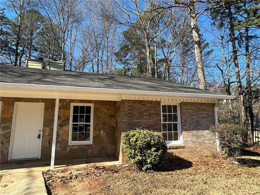 This beautifully updated duplex home has been completely renovated from top to bottom, offering a fresh and modern living space with brand-new luxury vinyl plank flooring, fresh paint, and stylish new lighting and ceiling fans running throughout. The kitchen is a standout, featuring sleek granite countertops, stainless steel appliances, and plenty of cabinet space perfect for both everyday meals and entertaining. A charming stone fireplace anchors the living area, adding warmth and character.

Both bathrooms have been upgraded with new vanities and contemporary fixtures, giving them a clean, modern feel. The primary bedroom includes an en suite bath, offering extra privacy and convenience. Outside, enjoy a private back patio and a spacious backyard with additional storage ideal for those who need a little extra room. Designated parking is located just steps from your door for easy access.

Tucked away at the end of a quiet cul-de-sac, this duplex offers a peaceful setting while keeping you close to everything Stone Mountain has to offer. Notably, it only has one shared wall, ensuring additional privacy in a duplex setting. Just minutes from Stone Mountain Park and historic Stone Mountain Village, you'll have easy access to scenic trails, outdoor activities, and local dining. With a prime location and thoughtful upgrades, this home is the perfect blend of comfort and style.

Don't miss out schedule your tour today!