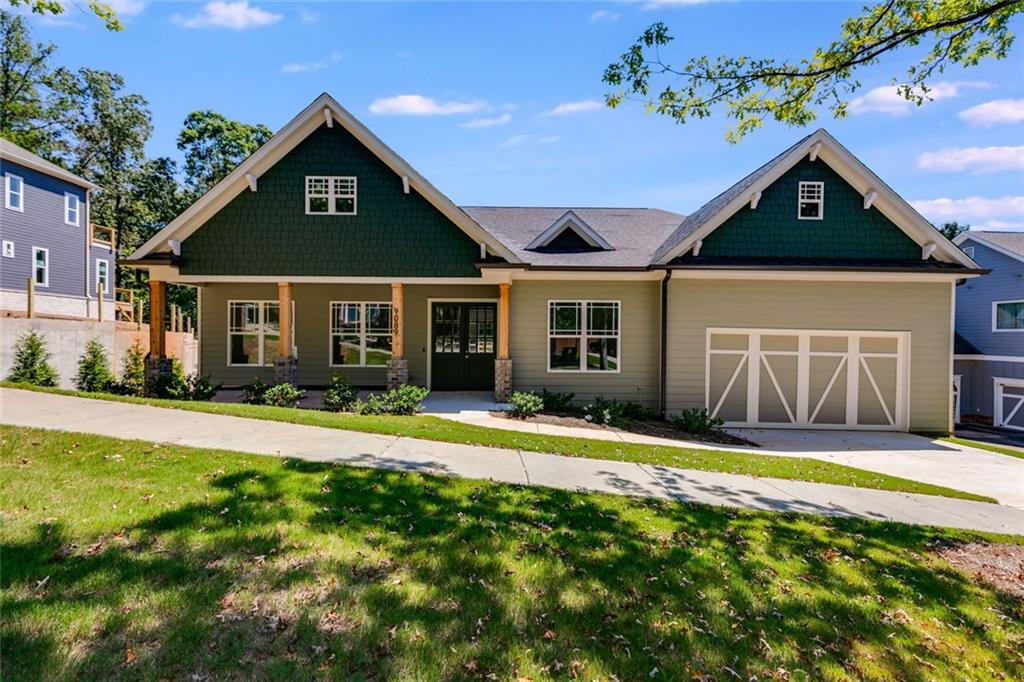 Seller and preferred lender are contributing to buy down your rate to 4.99%! Plus, this home includes a 2-10 builder warranty for added peace of mind. Even better — homes of this quality are typically priced at least $20 more per square foot, making this an incredible value. Seller also has 6 additional lots available in Tributary at New Manchester, 4 of which have not started construction yet and 5 homes under construction in Tributary at The Villages.
Step into elegance in this modern craftsman ranch. Through the double wood doors, the foyer opens into a tile foyer with soaring 10-foot ceilings throughout, 8-foot doors, and wide plank wood floors. Enjoy 8-foot tall cabinets in the chef’s kitchen, a massive 5 foot by 10 foot oversized quartz island with sink, beverage cooler, stainless vent hood, pendant lighting, tile backsplash, and butler’s pantry. Every oversized bedroom offers its own spa-style ensuite with quartz counters, tiled showers with frameless glass doors and linear drains, floor-to-ceiling tile with niches, and anti-fog vanity mirrors. The owner’s suite adds a freestanding soaking tub and an oversized walk in closet. Highlights include an 5-foot wide electric fireplace, tiled laundry with sink, unfinished basement plumbed for 2 future baths with finished stairway from the main floor, LED lighting, and a private rear deck. Located on a .38-acre lot near Lions Gate in Douglasville, Living in the Tributary subdivision, you'll have sidewalks, tennis courts, playground, pool and Clubhouse with easy access to golf, shopping, hiking, mountain biking and all of this with just a short commute to Atlanta.
Luxury, value, and future potential — all in one.