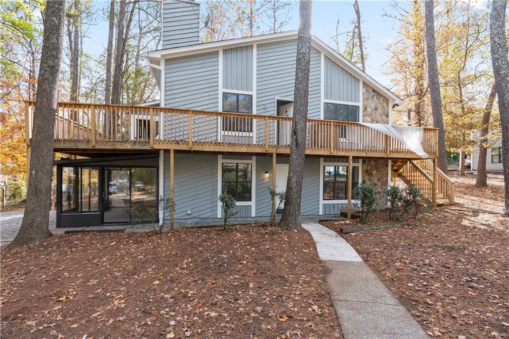 Welcome home to this Well-appointed centrally located Alpharetta residence. This recently renovated charming property is Move-in ready and offers a lifestyle of convenience. This home features a Modern cozy electric fireplace in the Family/great room, Separate dining room, kitchen with new Quartz countertops and Breakfast Bar, new appliances, new LVP flooring, 2 large bedroom with 2 recently renovated bathrooms. Step outside to the oversized sunroom that has direct access to the side patio perfect for a game day cookout or just a place for relaxation. Positioned for easy access to a major highway, this location effortlessly connect you to all the excitement Alpharetta/Roswell has to offer. Immerse yourself in Alpharetta/Roswell's charm and explore the local parks, diverse dining options, shopping, banking, car dealerships and exciting entertainment opportunities that make this neighborhood so greatly desired.