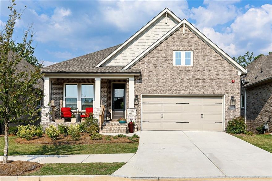 Unmatched Privacy & Luxury in Woodstock’s Premier 55+ Community!**Better than new and truly one-of-a-kind! This 3-sides brick, energy-efficient home sits on a premium lot backing to protected Rope Mill Park woods—your only backyard neighbors will be the wildlife. Property extends 15 ft beyond the fence, ensuring lasting privacy.**Inside, enjoy 11’ ceilings, neutral colors throughout, and an open-concept layout designed for modern living. The paint was even upgraded to sound damping. The chef’s kitchen features designer tile, extended-height lit cabinets, a walk-in pantry, and a large island with seating—perfect for entertaining. Plenty of quiet close pull out drawers and cabinetry which will delight any kitchen savvy buyer.**The spacious family room offers a gas fireplace for instant ambiance and easy access to the private deck. The upgraded neutral flooring is an interior decorator’s dream come true. In this thoughtful floor plan every window is placed for optimal privacy. The subtle upgrades here are impressive**Oversized luxury owner’s suite includes remote blinds and amply sized serene view sitting area. The spa-style bath, split vanities with tower storage, huge walk in closet adds to the Zen like retreat.**You'll also find a second ensuite bedroom on the main floor, perfect for overnight guests, a French-door hardwood floor office complete with floor outlets for printers/computer monitors, a half bath, a laundry room with upgraded cabinetry/ceramic sink, and an amply sized two car, epoxy-coated floored garage.**
The daylight basement is ready for finishing —stubbed for a second kitchen and luxury bath, with two additional circuit panels added for a future gym/exercise studio. There is plenty of room to create an entire ground level second living space, perfect for extended visitors or large family gatherings.**
Enjoy top-tier community amenities: pickleball courts, lap-lane pool with sun water deck, beautiful clubhouse with yoga studio, fitness center, kitchen, community garden and gathering spaces. HOA dues cover full lawn care—front and back for your home. Leave the yard work behind! All just minutes to charming downtown Woodstock's shopping, dining, trails, amphitheater and more. This is truly a rare, turn-key opportunity—don’t wait!