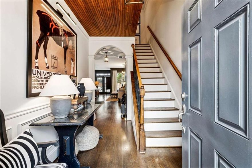 Enjoy your own fenced, level backyard with low-maintenance turf-a rare find for a townhome and perfect for relaxing, entertaining, or play.    This beautiful home lives like a single-family residence, featuring an open-concept main level, spacious bedrooms, and generous closet space. Nestled in a sought-after gated swim community, it showcases elegant moldings, custom finishes, and thoughtful design throughout.    Inside, the main level offers hardwood floors, great natural light, and seamless flow for everyday living. Upstairs, you'll find three bedrooms and two and a half bathrooms, including a primary suite with a sitting area ideal for a home office or private retreat.    Located in the highly rated Johns Creek school district, this home is just minutes from shopping, dining, parks, and all the conveniences the area has to offer. A rare combination of comfort, style, and location!