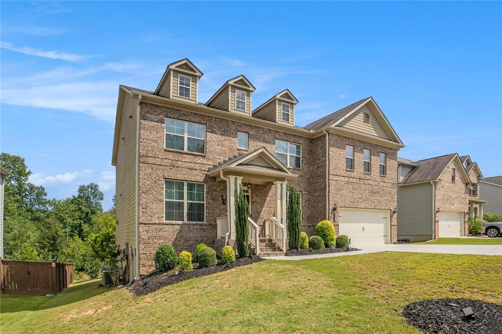 This home offers 5 bedrooms and 4 bathrooms across three levels, blending comfort, function, and entertainment.
Main Level
The main level features one bedroom with it's en suite, perfect for guests or multigenerational living. The open kitchen boasts a large island with seating for up to five, a spacious pantry, and a breakfast area, all flowing seamlessly into the family room with a cozy fireplace. A formal dining room comfortably seats up to eight, making it ideal for gatherings and special occasions. The mud room adds extra convenience and organization for busy households. Step outside to enjoy your patio, perfect for entertaining or relaxing outdoors.
Upper Level
Upstairs, you’ll find four bedrooms, including an expansive owner’s suite with a luxurious bath and a large walk-in closet. Three additional secondary bedrooms provide plenty of space for family or guests. Conveniently located on this level is the laundry room, saving you trips up and down the stairs.
Basement
The partially finished basement is an entertainer’s dream, featuring a custom movie theater that seats up to ten for an unmatched cinematic experience.