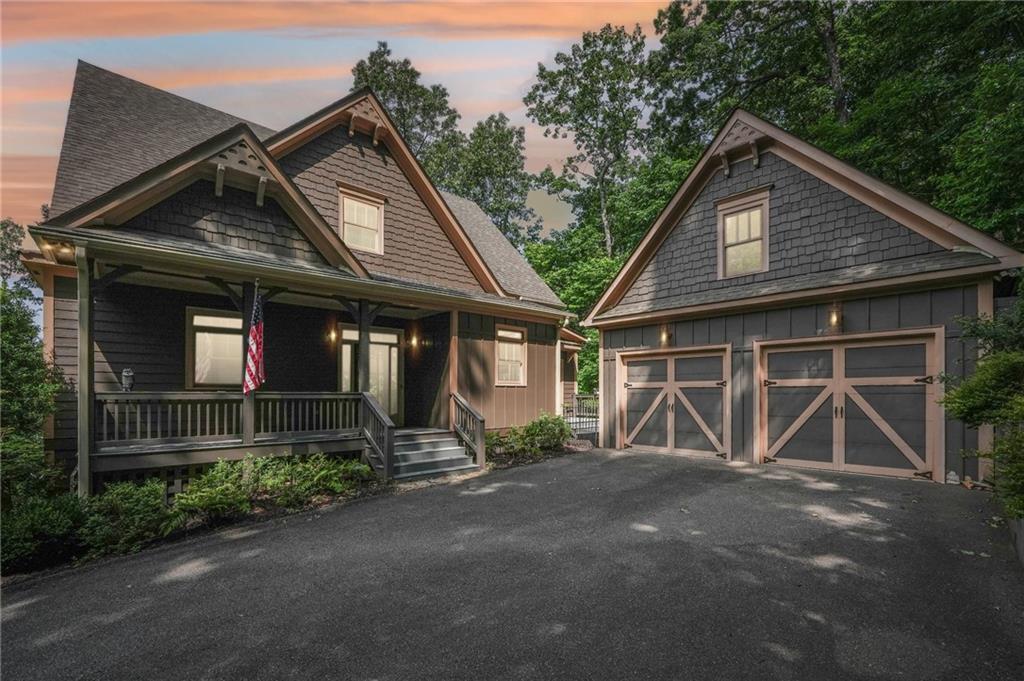 Stunning Move-In Ready Custom Home with seasonal Mountain Views, and two car detached garage.
Step into this exceptional home, perched on a picturesque knoll, where you can soak in brilliant sunsets, crisp mountain air, and peaceful surroundings. Designed for seamless indoor-outdoor living, it boasts two expansive decks and a spacious screened porch featuring EZ Breeze windows and vinyl flooring for year-round enjoyment.
Main level deck recently converted to Trex decking. New Lennox 18.0 Seer heat pump installed Jan 2023, new washer and dryer. The master closet has been upgraded with custom shelving. Owners added "Big Tex" gas logs to the main level fireplace.
Inside, luxury and comfort meet with a completely remodeled kitchen showcasing quartz and marble countertops, a sleek white subway tile backsplash, a high-end Viking gas cooktop, and stylish cabinetry. Hardwood floors through out main floor area and master suite.
The open-concept living space is enhanced by soaring 10-foot ceilings, a wall of windows, and a striking stone fireplace, creating a warm and inviting atmosphere. Upstairs, guests will feel right at home with a spacious office/sitting area with its own fireplace, two additional bedrooms, and a full bath plus two half baths. For energy efficiency, the west-facing windows feature solar tinting.
Entertainment lovers will be thrilled with the terrace level, where 10-foot ceilings provide an airy feel. This space includes a guest bedroom and bath, a generous family room with a stone fireplace, and a game area complete with a pool table, wet bar with granite countertops, and wine cooler, perfect for hosting unforgettable gatherings.