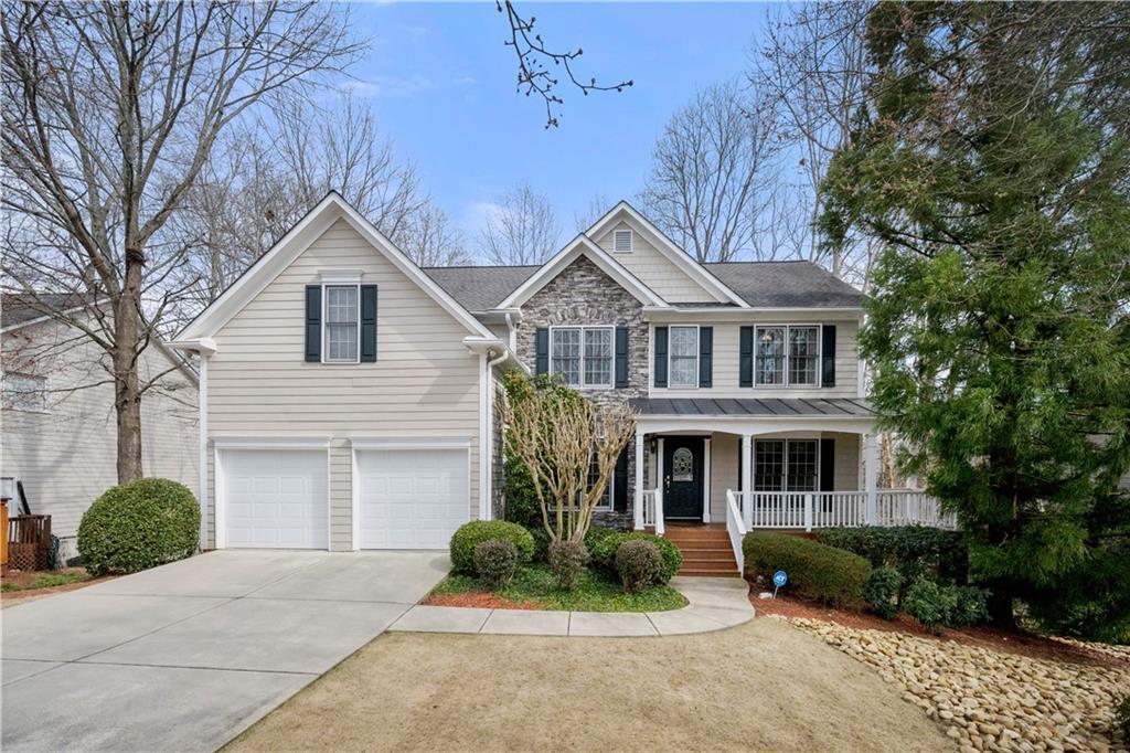 Welcome to this beautifully maintained traditional home nestled in the desirable location of Alpharetta-Forsyth County! This home was previously the model when the Subdivision was being built! Be prepared to fall in love with this rare opportunity in the Brookwood Lake Community. Mrs. Clean lives here! Immaculate condition! This home has picturesque views of the lake from the Kitchen, Family Room, and deck! Enjoy canoeing, kayaking, and watching the gorgeous sunsets from your deck. You can also enjoy family and friends gathering to watch the deer or ducks! Step inside to find a warm, inviting layout! Separate dining and living rooms with a kitchen open to the family room. The spacious kitchen has plenty of counter space, cabinets, a built-in desk, a breakfast bar, and a separate dining area. A bedroom and full bathroom are on the main level. Step upstairs to four additional bedrooms PLUS a loft! The primary owner's suite features a spacious walk-in closet, a spa bath with double vanities, and a separate soaking tub and shower! What a prime location with peaceful, serene views, yet close to everything you need. Don't let this great opportunity pass you by! Community amenities are across the street.