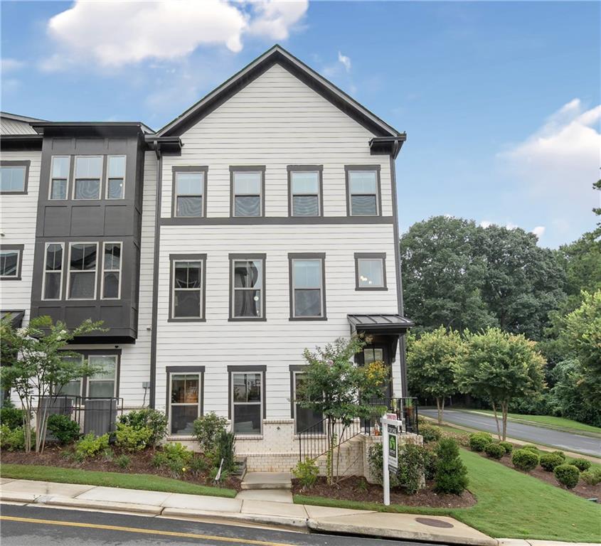 This is one of a kind - a corner unit surrounded by greenspace and overlooking Mason Mill Park! Step into elevated living in this exquisitely upgraded townhome in the highly sought-after Parkside at Mason Mill. Every inch of this designer-curated home has been crafted to combine high style with modern functionality, offering a refined, turn-key lifestyle in one of Atlanta’s most vibrant communities.
Sophistication starts at the front door, with rich hardwood floors and elegant architectural details that create a warm, elevated tone that flows throughout the entire house. Thoughtful custom accent walls add dimension and personality to every room, while curated lighting fixtures bring a stylish, elevated feel.
Relax in style - A custom-made electric built-in fireplace adds a striking element to the large living room while creating a cozy feel. A gorgeous showstopper!
A Kitchen That Stuns and Serves - The open-concept main living space is anchored by a chef’s kitchen that effortlessly blends beauty and utility. Crisp white cabinetry, an oversized quartz island, and a dramatic tile backsplash are complemented by top-of-the-line KitchenAid appliances, and a Samsung Smart Refrigerator with Family Hub™ touchscreen and Beverage Center™. A generous pantry ensures everything else has its place.
Sunlit Serenity - A light-filled sunroom offers stunning views of the park and its beautiful tree-line while sitting in a quiet part of the neighborhood, perfect fora morning coffee or quiet reading. The open private deck is perfect for al fresco dinners or a breath of fresh air at sunset.
Flexible Living for Guests or Work-from-Home Needs - The lower-level suite offers versatility and privacy, with double sliding doors, a full bath with a glass-enclosed tub, creates a space ideal for guests, a quiet home office, a playroom, or even a creative studio.
A Primary Suite That Delivers - Upstairs, the serene primary retreat is anchored by a tray ceiling with a custom ceiling fan and recessed lighting. Two expensive walk-in closets ensure storage is never a concern, while the spa-style ensuite bath features a frameless glass shower with built-in bench, elegant finishes, and a layout that makes getting ready feel indulgent.
Room for Everyone - Two additional upstairs bedrooms share a beautifully appointed bath with a glass-enclosed tub, offering space and style for family or guests.
A well-designed laundry room rounds out the upper level, with high-end Wi-Fi connected washer and dryer.
The home has an oversized two-car garage, with plenty of space for extra storage.
A Community That Complements the Home - At Parkside at Mason Mill, the amenities are as exceptional as the home itself. Residents enjoy a resort-style junior Olympic pool, a modern fitness center, and a fully furnished clubhouse with game tables and regular social events. Step out your door and directly into Mason Mill Park—120 acres of woodland trails, a creekside dog park, and pathways that can take you all the way to Emory or Medlock Park. Unbeatable Location - Ideally situated minutes from Emory, the CDC, the VA Hospital, and the new CHOA campus, this location offers effortless commuting with close access to I-85 and I-285. You're also just moments from Decatur Square, Toco Hills, boutique shopping, gourmet dining, and vibrant cultural experiences inside the Perimeter. This isn’t just a home—it’s a lifestyle designed for the way you want to live. Elegant, efficient, and effortlessly stylish. Come see it for yourself, your next chapter starts here.