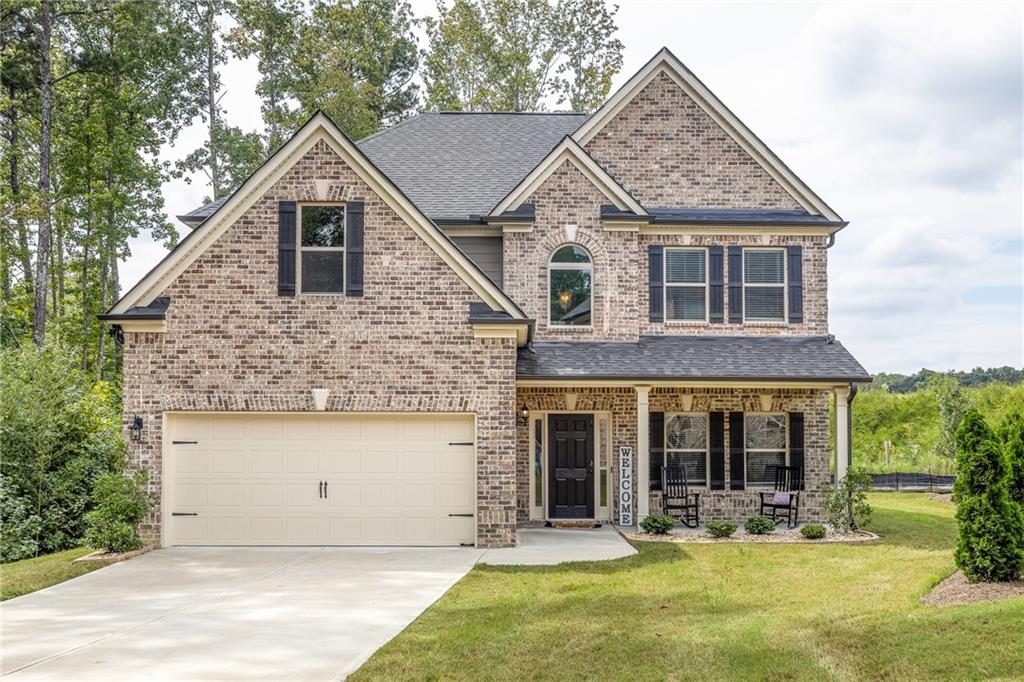 This beautiful 2019 build has been lightly lived in and still feels like new! Walk in to your new home and first you'll see a large formal living area or play room. Keep going through to family room and the kitchen with walk in pantry and eat-in kitchen area that opens with French doors to the back yard. Continue to your large separate formal dining area that can seat the whole family. Pass a half bath on your way around to the stairs and make your way up to the second level. First up is your oversized Primary bedroom with attached sitting area or nursery, and walk-in his and hers closets, then in to your large en-suite bathroom with soaking tub, separate shower, and double vanity. Next you have three more good sized bedrooms and a full bathroom plus laundry room on same level. Privately nestled in the back of the neighborhood with a two car garage, private backyard with shed and a small stream. Home also sits next to walking trail around the lake.