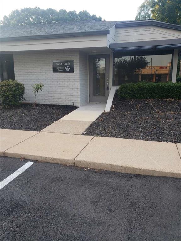 Available for Lease in North Fulton Executive Square Office Park located off Houze Way in Roswell next to Roswell Bicycles and across the street from new Tolbert Yilmaz Dance School. This Newly Remodeled End Unit is ideally located within the office park and features a Large Front Display Window wrapping the corner of the building.
The 964 sq. feet layout includes 4 Private Rooms, each featuring a Floor-to-Ceiling Window for abundant natural light. One of the Private Rooms is spacious enough to accommodate a Conference Table, making it ideal for meetings or collaborative work.
This unit also features a Private Front Entrance, dedicated Reception Area and Restroom. A breakroom with sink, microwave and refrigerator. and a built-in cabinet with countertop offers versatile space for a coffee station. A large closet area can be used for additional storage, seating or equipment. Upgrades include Modern LVP Flooring, and Fresh Paint. New Exterior upgrades include Fresh Paint, New Siding, updated Landscaping, Brand-New Roof, and fully Repaved Parking Lot completed in 2024.
The professional curb appeal is sure to impress both clients and prospective tenants! Located in the highly desirable North Fulton Executive Square Office Park at the corner of Houze Way and Houze Road, perfect for your business.
Rent Includes: Trash, Water and Exterior Maintenance. Tenant responsible for Gas, Electric, and Cable/Internet.