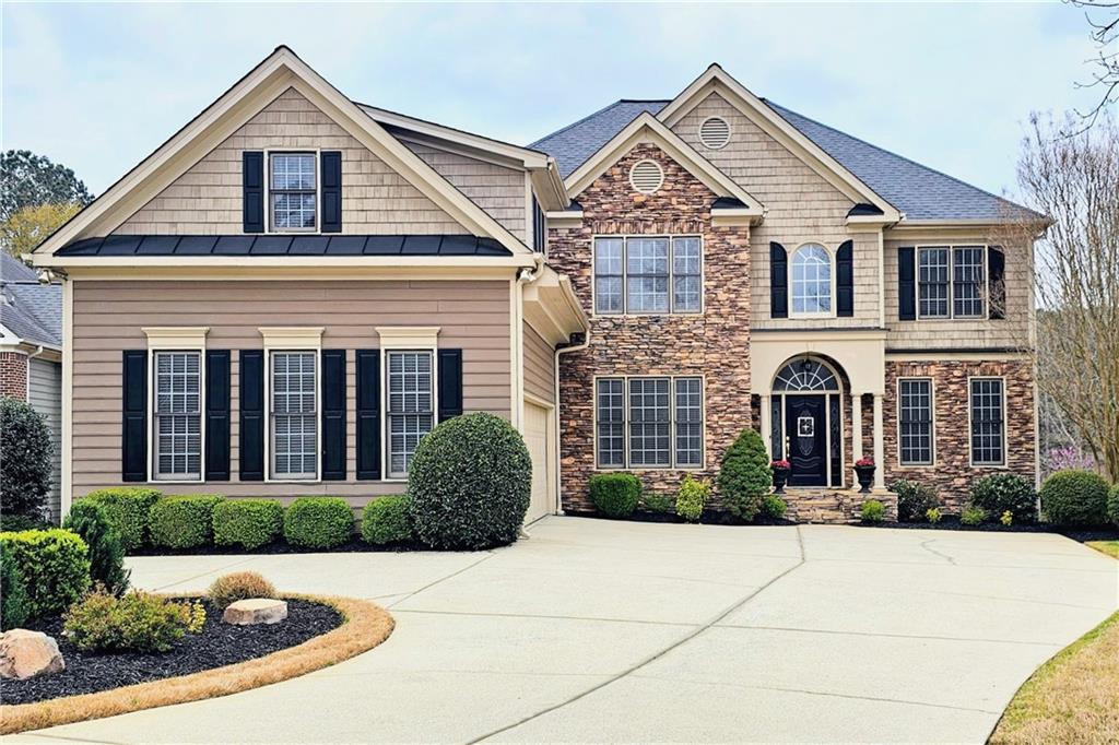 Just a short walk from the Bentwater Golf Clubhouse, and located in the desirable North Paulding High School district, this spacious and beautifully maintained 6-bedroom, 4-bathroom home on a prime cul-de-sac lot overlooking the 9th fairway in the sought-after Bentwater community is a MUST SEE!
The main level features a welcoming two-story foyer, separate formal living and dining rooms, a guest bedroom with a full bath, and an open-concept family room with a cozy fireplace and custom built-ins. The bright and spacious eat-in kitchen is perfect for entertaining, featuring a large center island that seats five, granite counters, stainless steel appliances, and a breakfast area with beautiful views of the golf course. Adjacent to the kitchen, you’ll find a large pantry, mudroom, full laundry room, and a kitchen-level 2-car garage with an additional parking pad—ideal for a third vehicle or golf cart.
Upstairs, you’ll find four generously sized bedrooms and two full bathrooms. The oversized primary suite includes a spa-inspired ensuite with double vanities, a soaking tub, separate shower, and an expansive walk-in closet—complete with a convenient laundry chute to the main level.
The fully finished terrace level offers excellent versatility, featuring a media room, game room, sixth bedroom, full bath, and an additional flex space perfect for a home gym, office, or workshop. The basement also includes additional laundry hookups for added functionality.
Enjoy the outdoors with multiple inviting living spaces, including a back deck overlooking the fairway, a covered patio below, a playset, and a beautifully landscaped fully-fenced backyard with room to gather, grill, and relax.
As a Bentwater resident, you’ll enjoy resort-style amenities including a clubhouse, Jr. Olympic swimming pool plus four additional neighborhood pools, a splash park, multiple playgrounds, tennis and pickleball courts, basketball courts, miles of walking trails, and expansive community green space.
Ideally located just under 0.5 miles from the intersection of Graves Road and Cedarcrest Road, 2.5 miles from Hwy 41, and approximately 7 miles from I-75. Grocery stores, restaurants, gas stations, fitness centers, and highly rated schools are all nearby, making 174 Waterstone Pointe a rare opportunity to enjoy both convenience and an elevated lifestyle in one of Acworth’s premier golf course communities.