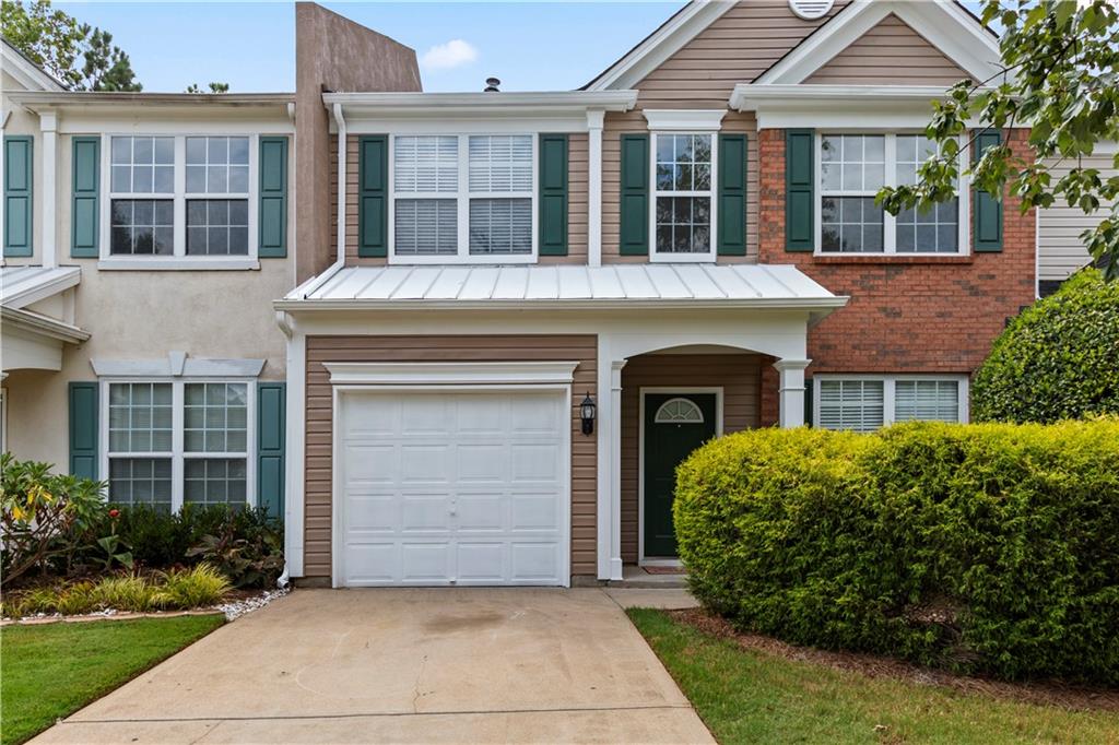 Nestled in the heart of Peachtree Corners, Medlock Corners presents an exceptional opportunity to own the largest townhome floorplan in the subdivision. This well-kept unit features 3 spacious bedrooms, 2.5 bathrooms, and 1,636 square feet of living space, all designed with comfort and functionality in mind. Fresh new paint and new white cabinetry in Kitchen and baths. New Stainless Steel kitchen appliances. Built in 2000, the home boasts an inviting layout with vaulted ceilings in the primary suite, a walk-in closet, and a gas fireplace that warms the open living and dining areas. A separate family room provides additional space for entertaining or relaxing, while central heating and cooling ensure year-round comfort. The attached one-car garage and generously sized 7,405 sq ft lot add convenience and curb appeal. Located in a peaceful, landscaped community just minutes from Peachtree Industrial Blvd and Medlock Bridge Rd, this townhome offers quick access to nearby shopping, dining, parks, and top-rated schools including Norcross High School's International Baccalaureate program. Whether you're a first-time buyer, investor, or simply seeking a low-maintenance lifestyle in a prime location, this move-in ready home combines space, value, and charm. Plenty of driveway parking.