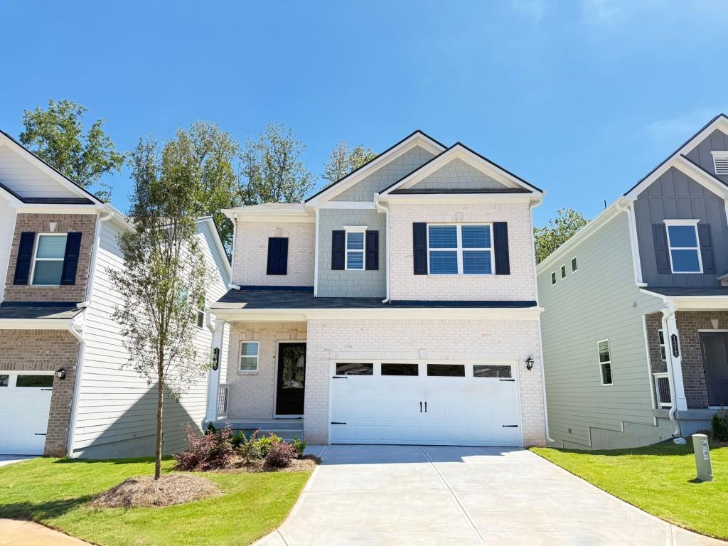 Move in Ready! The Braselton II plan with an unfinished basement in Sanders Park by Smith Douglas Homes. This thoughtfully designed home features a corner rear covered patio, easily accessed from the spacious eat-in kitchen which includes a central island with pendant lighting, Quartz countertops, upgraded appliances, tile backsplash and 42" upper cabinets for added storage. The kitchen flows seamlessly into a bright and open family room with a stylish linear fireplace. Vinyl Plank flooring is featured throughout the main level. Upstairs features four bedrooms including the primary suite. The primary suite includes a tray ceiling enhancing the height of the room and a massive walk-in closet with a private bath complete with a Garden tub, separate tiled shower and tile flooring. The laundry room is conveniently located on the second floor near all the bedrooms. Both floors have 9ft ceiling heights. The Unfinished basement offers endless potential to be used to suit your lifestyle - home gym, media room additional storage etc! Primary photo of home secondary photos are representative of plan and not of actual home . Seller incentives with the use of our preferred lender.