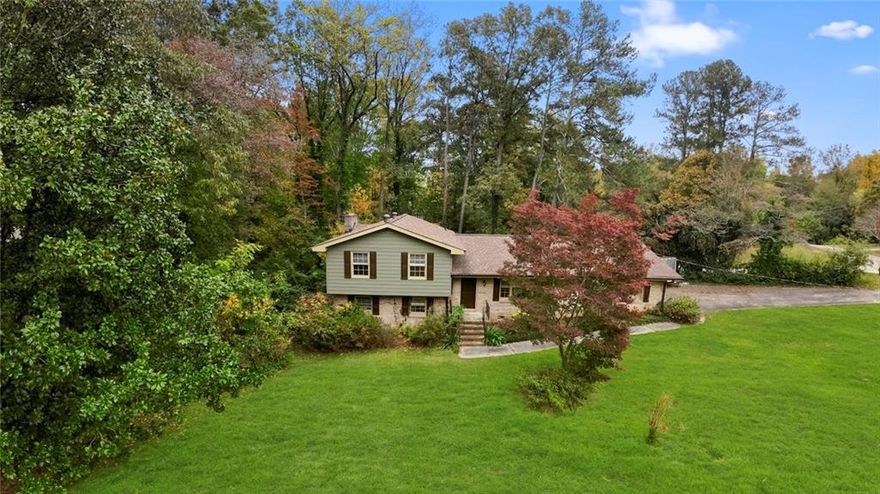 **Perfect for a handy owner-occupant or purchase with a renovation loan**

Envision yourself in this spacious 4-bedroom, 2-bathroom split-level home, designed for both relaxation and entertaining. Step into a cozy living room featuring a charming fireplace, perfect for gathering on cool evenings. The kitchen is updated with sleek granite countertops, offering plenty of space for meal prep and casual dining.

Outside, enjoy a large deck overlooking a generous lot—ideal for entertaining friends and family or unwinding in a peaceful setting. The primary suite boasts a double vanity for added convenience, while all bedrooms provide ample space and comfort. 

Located just minutes from shopping, dining, and the East-West Connector, this home combines tranquility with easy access to all the essentials. Make this your next home and enjoy the perfect blend of comfort and convenience!


"Buyer offered $1000 credit at closing with the use of the seller's preferred lender!"